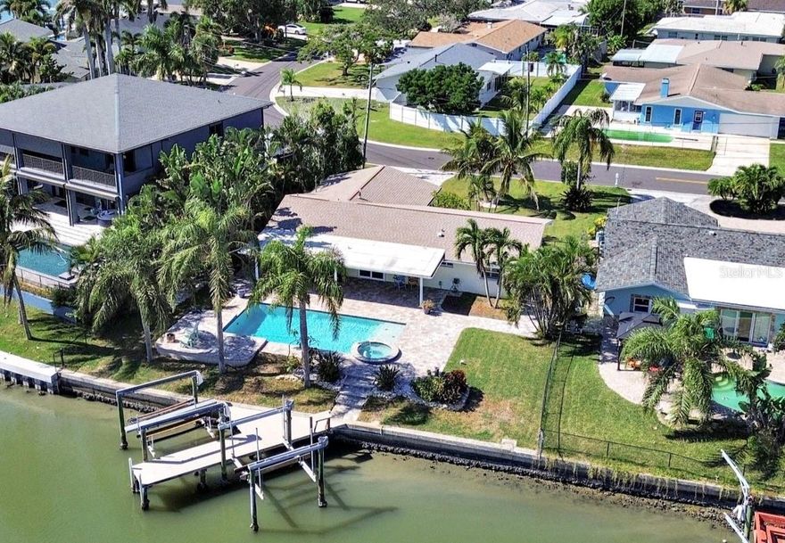 Welcome to your waterfront dream retreat in the highly desirable community of Oakhurst Shores in Seminole! This newly renovated coastal residence offers the perfect combination of luxury, style, and Florida outdoor living with direct water access and two boat lifts (13k and 7k).
Featuring 3 spacious bedrooms, 2 modern bathrooms, and 2 car garage, this home has been thoughtfully updated throughout. The brand-new designer kitchen showcases sleek cabinetry, quartz countertops, stainless steel appliances including a gas stove, and a large island, perfect for entertaining. Step outside to your backyard oasis, where you’ll enjoy a large sparkling pool with gas heated spillover spa, expansive paver deck, and covered lanai—ideal for year-round relaxation. Boaters will appreciate the private dock with TWO lifts, offering quick access to the Intracoastal Waterway and Gulf of Mexico. Located just minutes from Gulf beaches, Seminole City Center, dining, parks, and top-rated schools, this move-in ready home is perfect for those seeking the waterfront Florida lifestyle without compromise. Additional features include - Natural Gas Tankless Water Heater,  Main roof - 2018, Flat Roof - 2016, Pool resurfaced - 2012, Boat Lifts installed - 2012, HVAC - 2017