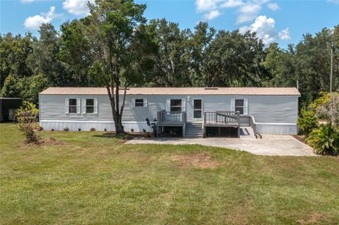 Photo of 8930 Hammock Loop, Polk City, FL 33868 (MLS # L4954915)