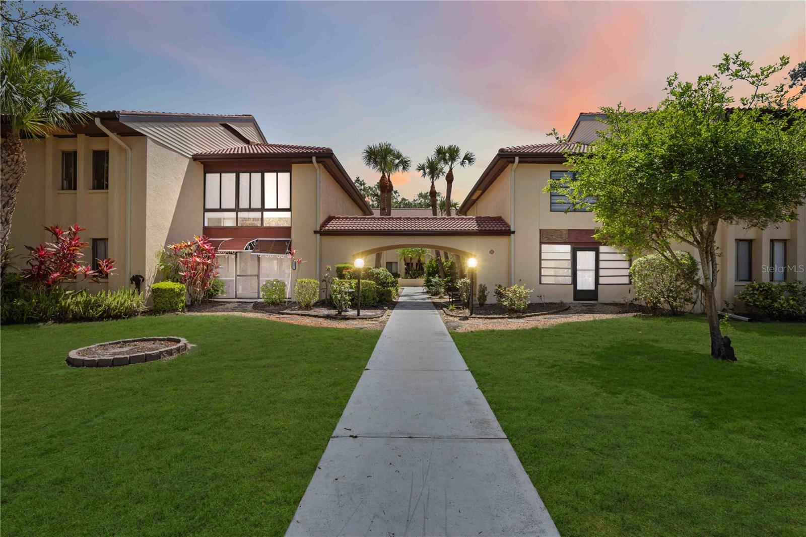 Welcome Home To Your 55+ Retreat! Step into tranquility as you walk through the serene courtyard to your spacious, second-floor condo. This beautiful 3-bedroom, 2-bathroom home offers the perfect blend of comfort and charm. The enclosed lanai overlooks large lush trees and offers a versatile space for your office or a hobby room. You'll find large windows throughout for plenty of natural light. The primary ensuite includes built-in storage and a private balcony just off the primary bedroom. All three bedrooms are large and offer ample storage.
The dining room has views of the peaceful courtyard. There is also an electric chair lift for convenience and comfort for easy access to the home. The community amenities include a pool, tennis courts, and grilling area for outdoor fun. You'll also have direct access to the Manatee River for kayaking and paddle boarding. Come see why this is the perfect place to call home!