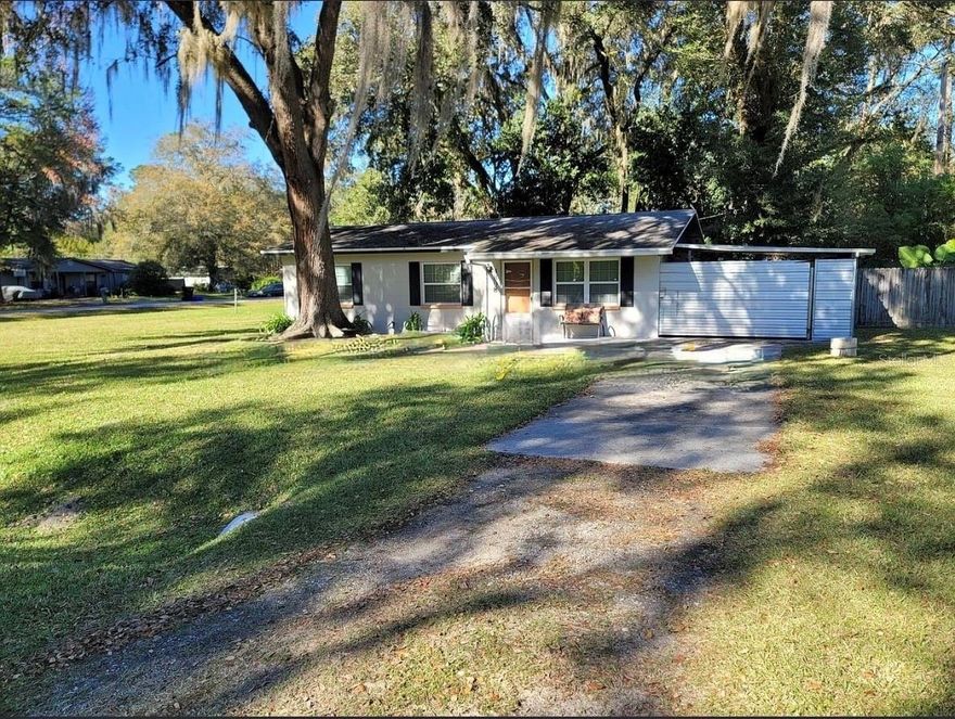 Looking for a cute, low-maintenance, money-making machine just minutes from UF? Say hello to this concrete-block charmer that comes with its very own long-term tenant — aka instant income, no awkward “please rent my house” phase required.
Concrete block construction — sturdy, dependable, and basically Florida-proof.
Roof from 2019 — young, fresh, and ready to protect your investment for years.
A/C from 2018 — cool, calm, and collected (just like your future cash flow).
Under 10 minutes to UF — perfect for UF attendees, staff, and anyone who hates long commutes.
Fenced yard — ideal for pets, privacy, or backyard hammock vibes.
Large living room — plenty of space for movie nights, game days, or dramatic reenactments of exam stress.
3 spacious bedrooms — roomy, rentable, and always in demand. 
Photos are virtually staged