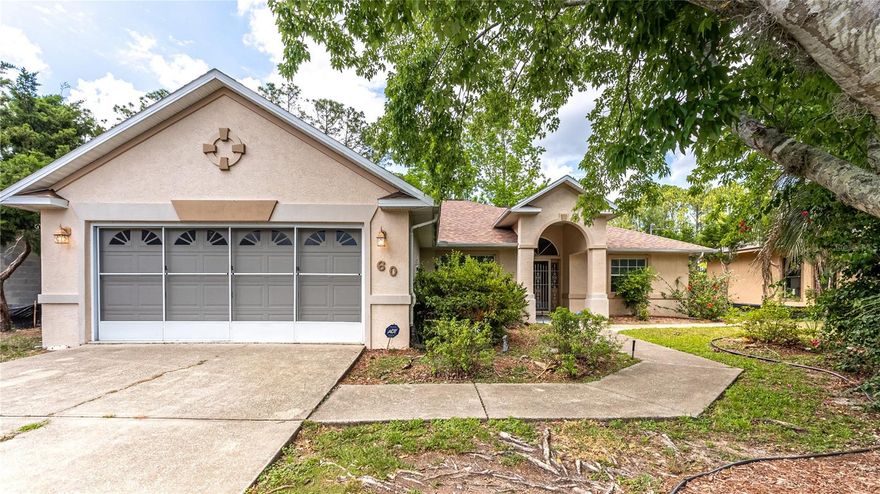Welcome to your bright and beautiful home in the desirable W Section of Palm Coast. Located on a peaceful freshwater canal, this 3-bedroom, 2-bath home features a spacious split floor plan and a bonus room with a wall-length window offering a gorgeous water view. As you step through the front door, you’re greeted by an open layout with vaulted ceilings and lots of natural light. The main living area flows easily into a large Florida room where you can relax and take in the calming view of the canal. The master suite is truly a retreat. It features oversized windows with water views, two walk-in closets, a spacious bathroom with split vanities, a soaking tub, a separate shower, and a private toilet area. The additional bedrooms are generously sized, and the second bathroom includes a walk-in shower. There’s also a bonus room that can serve as a home office, playroom, guest space, or whatever suits your needs. The kitchen offers plenty of cabinet and counter space and opens into a breakfast nook where you can enjoy your morning coffee with a view of the backyard and canal. Outdoor enthusiasts will love the backyard setting. Whether you're fishing off your private mini-dock, launching a canoe for a peaceful paddle, or just sitting in the screened Florida room, it’s a perfect spot to enjoy the Florida lifestyle. Out front, the screened garage adds another flexible space for working out, projects, or playtime without the bugs. This home has so much to offer, both inside and out. Come see it for yourself and imagine living in this peaceful and well-designed space.