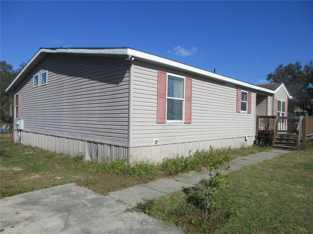 Photo of 18415 SE 58th Place, Ocklawaha, FL 32179 (MLS # OM714420)