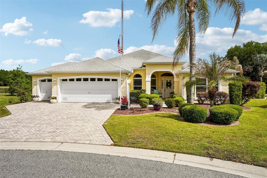 Tucked at the end of a quiet cul-de-sac in the centrally located Village of Caroline, this beautifully maintained 3-bedroom, 2-bath pool home offers 1,887 square feet of comfortable, thoughtfully designed living space. Mature, manicured landscaping and paver accents create standout curb appeal, while the 2-car garage plus dedicated golf cart garage adds everyday convenience. Inside, the open-concept layout features crown molding, elegant finishes, and no carpet throughout. The kitchen is equipped with top-of-the-line stainless steel appliances, a breakfast bar, and a dining area that flows seamlessly into the spacious living room, where sliding glass doors open to a fully enclosed Florida room, filling the space with natural light. The primary suite is a true retreat, offering generous space, private sliding glass door access to the lanai, and a well-appointed en suite bath with a large dual-sink vanity, walk-in shower, and a comfortable, functional layout designed for ease and relaxation. The split-bedroom floor plan provides added privacy for guests or additional living space. Out back, enjoy a large screened enclosure with an in-ground pool and peaceful preserve views, all set on just under a quarter acre—ideal for both relaxing and entertaining. Residents enjoy access to nearby recreation, including the Caroline Neighborhood Recreation Center with a pool, as well as Coconut Cove Village Recreation Center offering another pool, tennis, pickleball, shuffleboard, and more. Conveniently located near golf and major roadways, with shopping and dining just minutes away at Lake Sumter Landing Market Square, this home also features the added benefit of no bond. Seller willing to offer a credit to the buyer, providing flexibility for future updates or improvements. Mortgage savings may be available for buyers of this listing.
