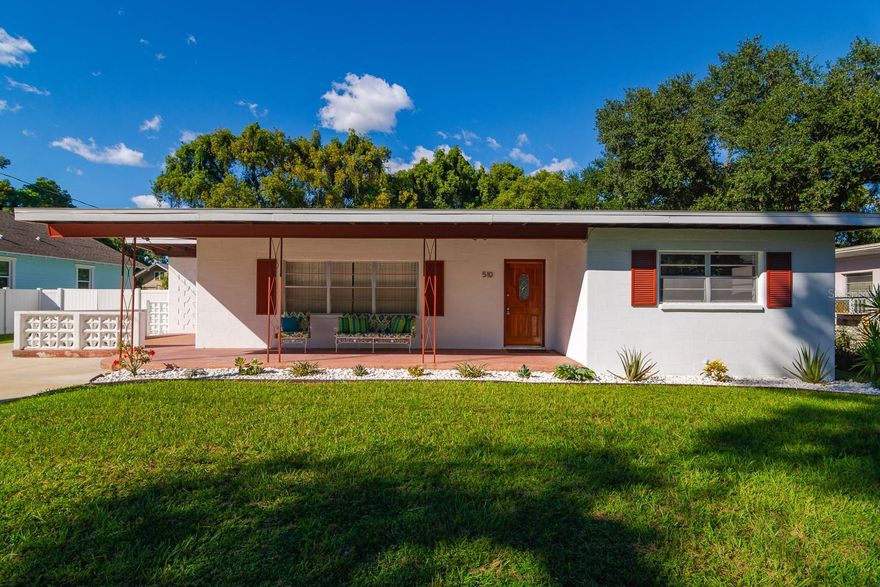 Mid-Century Modern Charm Meets Contemporary Convenience on a 1/4 acre, double-lot. Step into this stylish mid-century modern gem featuring vaulted ceilings and classic terrazzo floors that evoke a cool 1950s vibe. The brand-new kitchen boasts sleek cabinets, countertops, and modern appliances—perfect for both everyday living and entertaining. Enjoy the spacious family room filled with natural light from abundant windows, seamlessly connected to the kitchen for an open, airy feel. The large, fenced backyard offers plenty of space for outdoor fun and games, while the covered front porch invites you to relax and unwind. Two hall bathrooms showcase original 1950s tile, adding a nostalgic touch to this thoughtfully updated home. The three bedrooms offer generous closets and lots of bonus storage.  The large laundry and storeroom has its own entrance. Major systems including the roof, plumbing, electrical, and HVAC have all been recently updated, giving you peace of mind. Located just minutes from Downtown Tampa and the vibrant Armature Works entertainment complex, this home offers the perfect blend of vintage style and modern living.