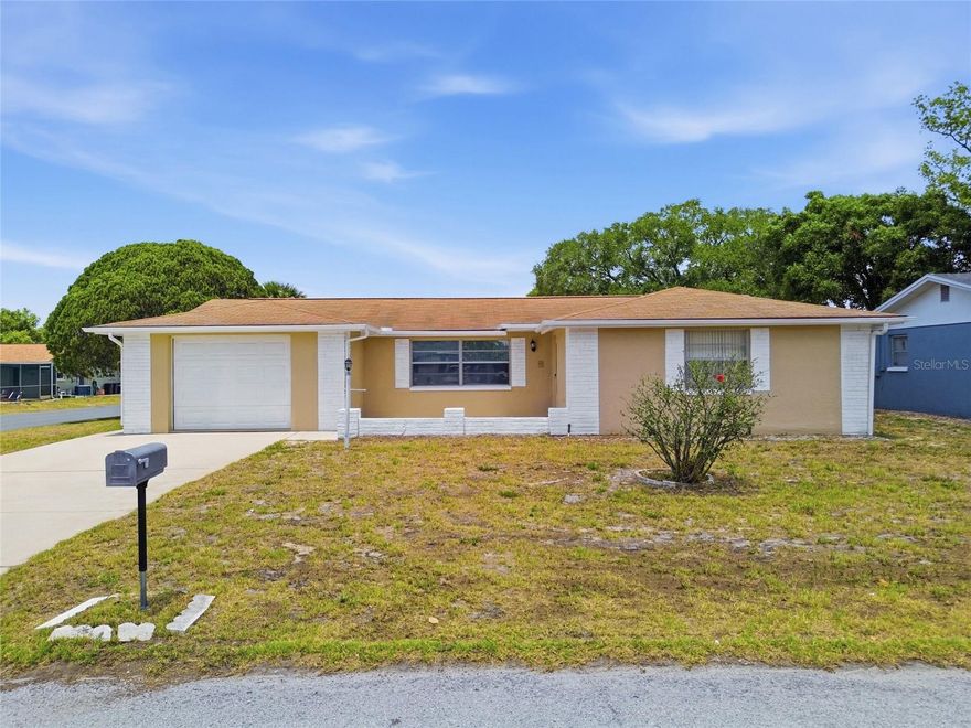 Welcome Home! This Beautifully well maintained property is move-in ready with NEW LUXURY VINLY PLANK FLOORING and FRESH INTERIOR AND EXTERIOR PAINT! Featuring 2 bedrooms, 2 bathrooms, and plenty of space to entertain with a large, enclosed patio and spacious front courtyard, this home is perfect for easy Florida living. Enjoy the freedom of NO HOA, NO DEED RESTRICTIONS and NOT IN A FLOOD ZONE-all just minutes to our Stunning Florida Beaches, Tampa International Airport and Shopping! Schedule your tour today before this Beauty is gone!