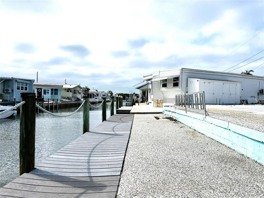Exceptional waterfront opportunity in Trailer Estates! This vacant lot offers 44 feet of water frontage on a canal with direct access to Sarasota Bay, making it ideal for boating enthusiasts and those seeking the ultimate coastal lifestyle.

The property features a composite dock and concrete seawall already in place, along with an existing concrete pad—providing a valuable head start for your future build. Whether you're planning a seasonal retreat or full-time residence, this is a rare chance to create your own waterfront home in a highly desirable marina community.

Enjoy easy access to open water while being tucked into a protected canal setting. Opportunities like this are limited—bring your vision and build your place on the water.

Located in Trailer Estates, a Special Park and Recreation District governed under Chapter 418, Florida Statutes, residents own their land with no lot rent, CDD, or HOA fees. The annual park tax covers cable, high-speed internet, trash pickup, fire and rescue services, and access to outstanding amenities including a marina with rentable boat slips, private beach, pool, hot tub, fitness center, shuffleboard, bocce ball, pickleball, woodshop, and nearly 60 active clubs and social events. Experience one of Sarasota Bay’s most vibrant and welcoming 55+ communities.