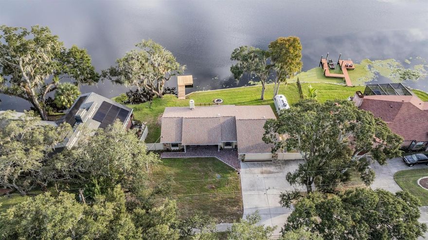 Beautiful waterfront home located right on the Hillsborough River! Just a short drive from James A Haley VA hospital, USF, Hard Rock Casino, Florida State Fairgrounds and more!! If you love gorgeous water views and fishing from your own private dock, then this is the one for you! The roof and gutters are new and so is the dock in the back so the big items are already done for you. The home features 3 bedrooms, 2 full bathrooms, and a big 2 car garage with 1,809 Htd SqFt of living space. The extended driveway offers plenty of space for parking a boat or RV and the front brick walkway has been newly installed. Inside, the home has an open concept split floor plan that is perfect for entertaining. The formal living and dining rooms are at the front of the house and bathed in natural light from the big front windows. The kitchen offers plenty of cabinet and counter space with a breakfast bar and separate eating area. From the kitchen is the cozy great room that has a wood burning fireplace and a spectacular view of the river. Step out the back door on to your private wood deck where you will love firing up the BBQ or continue further to your own private dock right onto the Hillsborough River! You’ll also be conveniently located close to plenty of restaurants, shopping, parks and more. Just 3 miles to Busch Gardens Amusement Park, 3.4 miles to I-75, 4 miles to I-275 and 19 miles to Tampa International Airport. This is one you cannot miss! Come and see it today!