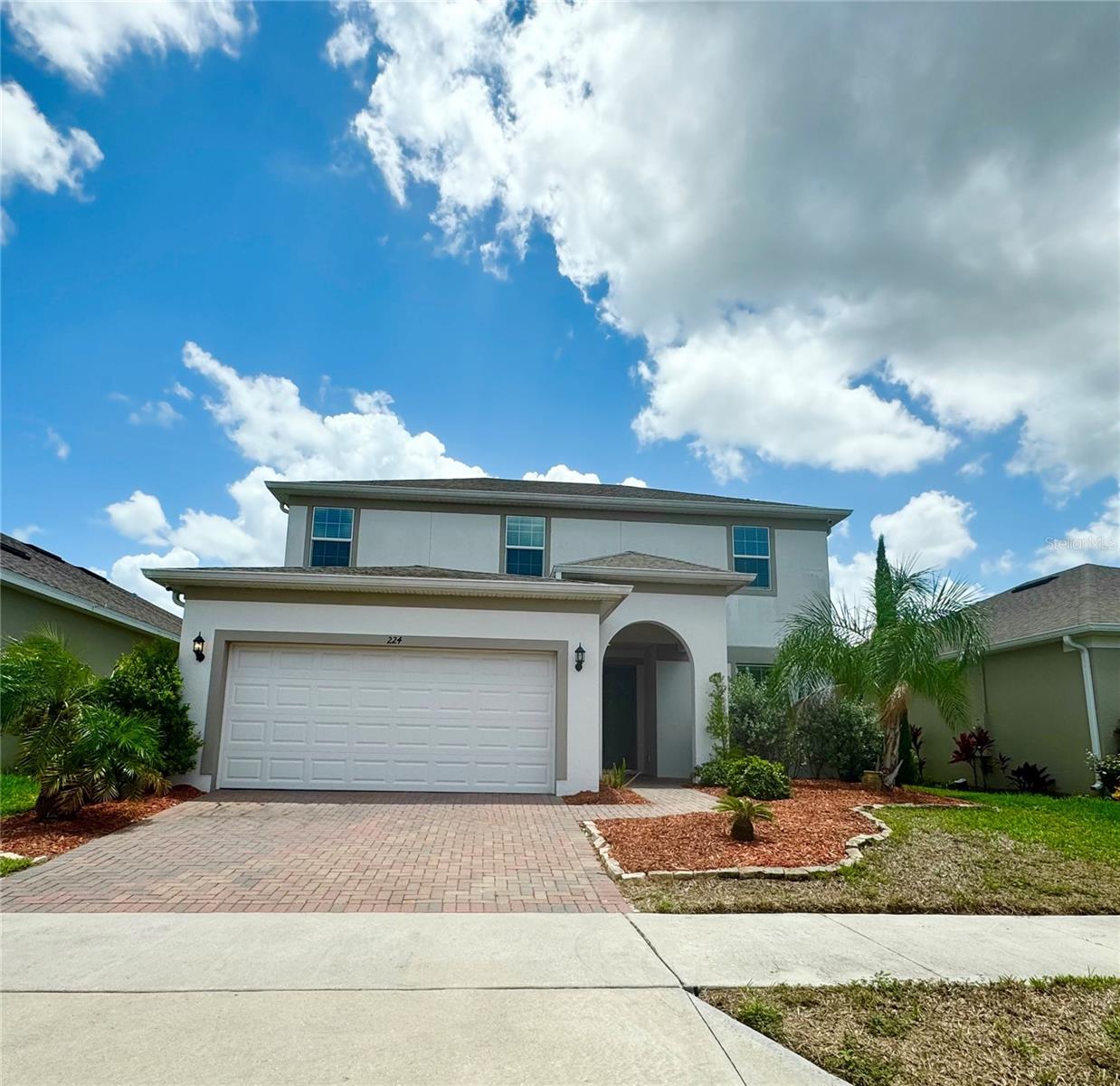***AMAZING LEASE OPPORTUNITY!!!!!! BEAUTIFUL, ENERGY EFFICIENT, two-story home with Solar Panels! Looking from the outside you can see the brick driveway with a matching back porch. Connected to the driveway is a roomy two-car garage, which leads directly inside. Walk through the front door and be greeted by the stairs and a hallway that opens into the beautiful living room and kitchen. The living room features a gray stone accent wall with an area built just for a TV. Throughout the downstairs of the home there is bright and colorful lighting all over the ceilings and in the kitchen. Within the kitchen there are stainless steel appliances, beautiful, stone back splash, dark 42" cabinets, marble counter tops, and beautiful tile floors. In the living room the sliding glass doors open to the brick porch, with a stunning view of the back yard. Also downstairs, you can find one of the four bedrooms, a modern bathroom, and an extra room. Take the stairs and walk up to a spacious common area which connects to the master bedroom, the remaining two bedrooms, and another bathroom. The master bedroom is stunning and features a walk-in closet and a spacious and updated bathroom. This home is close to shopping, restaurants, and Disney Theme Parks!