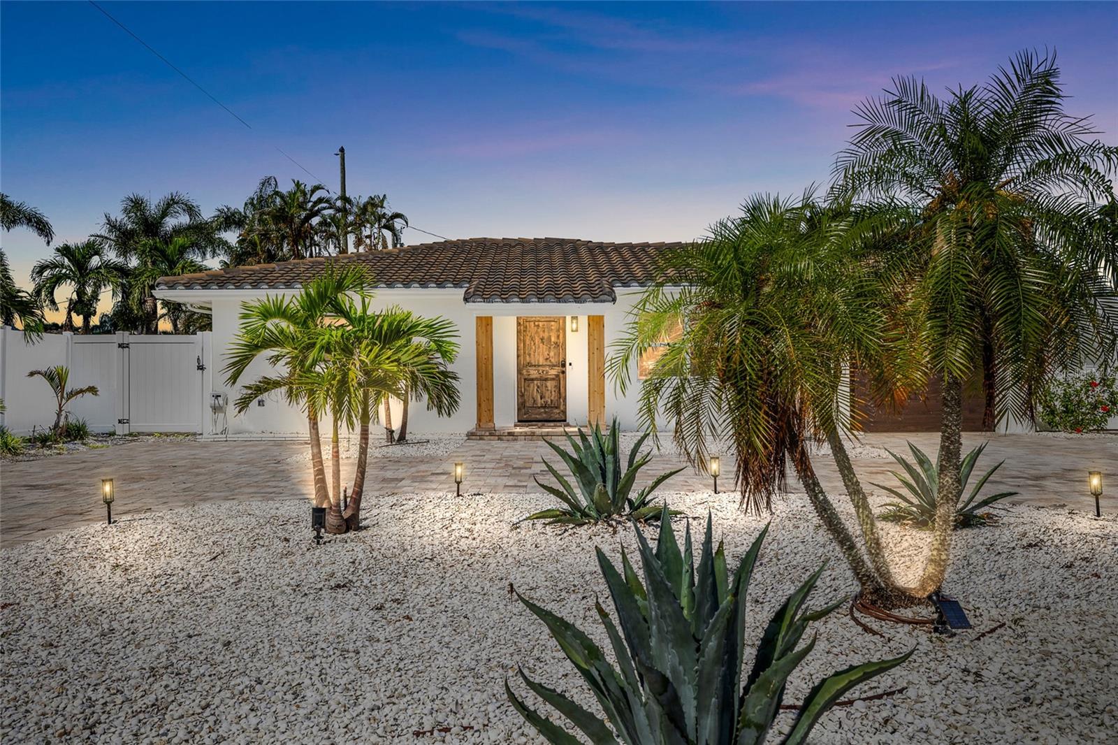 Bright, Breezy, and Beautifully Updated—Just Missing YOU, Your Toothbrush & Flip-Flops! BRAND NEW FULLY FURNISHED HOME.
Every inch of this Boca Ciega Isle beauty has been reimagined with luxury in mind...This completely renovated 2 bed, 2 bath block home has been modernized from top to bottom—New Plumbing, Full Electrical Rewire, Added New Wall Insulation, 3-panel Modern Interior Doors, New luxury Garage Door and Opener, Matte Black Hardware, all New Keyless Door Entry, and Upscale Finishes throughout. The Chef’s Kitchen wows with Top-of-the-line Taj Mahal Quartzite counters, 42" Modern White Cabinetry, a large Sage Green Island with Farmer’s Sink and Breakfast Bar with additional Under Island Countertop Cabinets and all Premium Samsung BeSpoke WiFi Appliances. Spacious master suite with luxurious bath and upscale Bidet. Wood-look porcelain floors, wood-beam ceilings accents, designer lighting, and includes a massive 85” TV with surround sound. New rain sensor irrigation, new backyard privacy fence along with a newly furnished huge backyard that has room for a gigantic pool, garage with new luxury garage door & opener, circular paver driveway for plenty of parking for cars, golf cart, and beach toys. Newer tile roof (2022), HVAC system (2020) equipped with a UV-C light for cleaner, healthier air, water heater (2024). Includes whole house Wyze camera system, Wyze Thermostat managed also by your phone, camera flood lights and newly installed coach lights. Short walk or cart to beaches, dining, and shopping. Airport is 30 min drive. Sellers relocating to Europe and anticipate a quick sale! So hurry, don't miss your chance at owning this Fully Furnished spectacular property!