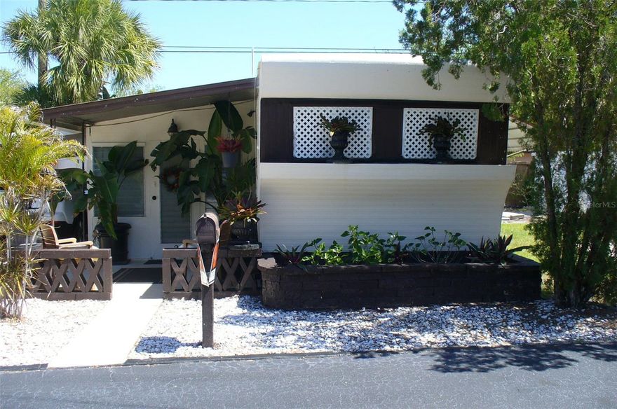 “NEW MOON” mobile home in 55+ RESIDENT OWNED park in one of the best and safest neighborhoods in St. Petersburg. Owned for 21 years by non smoking older handyman and veteran. Fully furnished = 50" Sony LED TV, surround sound system, leather furniture, zero gravity recliner, memory foam mattress, locker, office with desk, file cabinet & jewelry chest. Huge backyard (one of best lots in the park), no neighbors on two sides means privacy, 2 patios, 5 gardens, enclosed porch, covered carport with parking for two, wood barn style shed, newer appliances = propane stove, new propane tank & regulator, refrigerator, wall AC, combo washer/dryer, micro/convection/air fryer, bathroom vanity and toilet and water filter in kitchen sink. Mobile is 460 sq. ft. plus large porch, front half of mobile rebuilt with pressure treated 2×4’s, spray foam insulation, sheet rock, wood floor, windows. Roof sealed and mobile painted in 2024, then wood shed, 2 patios, office and bathroom painted 9 months ago. Low park fees $177 includes water sewer garbage and lawn, no land lease. Cats and small dogs OK (max 2). Great to live in or as rental property (no restrictions). Across from the 133 acre Walter Fuller Park with walking trails, a pool, picnic areas, a dog park, lake, basketball / tennis / pickleball courts and several festival & sporting events. Close to Tyrone Square mall, restaurants, auto shops, Walmart, Target and 10 minutes to St. Petersburg General and VA Hospitals. Lots more info and pictures to those seriously interested. Price includes share in the co-op.