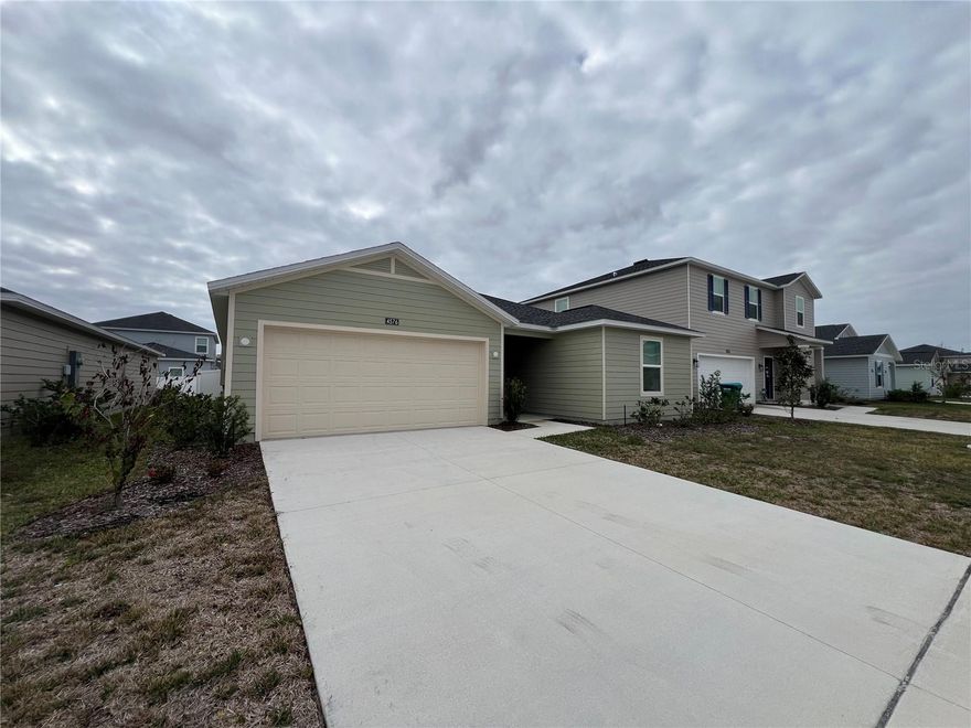 Welcome to this stunning brand-new home with many upgrades in Sunny Ocala, Florida! This thoughtfully designed new construction offers 4 spacious bedrooms, a dedicated office, and 3 full bathrooms, including an in-law suite for guest. The open-concept layout creates a seamless flow between the main living areas, perfect for both everyday living and entertaining. The kitchen opens to the living and dining spaces, offering a welcoming gathering place filled with natural light. Neutral finishes and clean design throughout allow you to easily personalize the space and make it your own. No carpets, all LVP throughout. The primary suite serves as a peaceful retreat, with its own separate shower, tub and huge walk-in closet and the additional bedrooms are generously sized. The dedicated office provides a quiet workspace or flex room to suit your needs. Built with energy-efficient features and low-maintenance materials, this home offers peace of mind along with modern convenience. Seller has invested significant upgrades over the base model. Located in most desirable, Southwest Ocala, near, shopping, dining, medical facilities, and major roadways, while still enjoying a quiet residential setting. With no previous occupants, this move-in-ready home is waiting for its first owners.