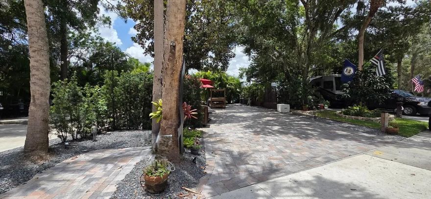 RV LOT ALERT!  Welcome to this STUNNING renovated RV Lot in River Ranch RV Resort located in Central FL- this is the resort with ALL THE FUN THINGS TO DO!! This RV Lot offers the perfect mix of sun & shade and is ideal for weekend escapes, snowbird season, or vacation fun in the Florida sun!  The first thing you will notice is the GORGEOUS grand Oaks that canopy over the Lot providing the perfect combination of sun and shade!  The lot has been finished with gorgeous sealed pavers with multiple shaded seating areas and a grilling area!  The back of the lot is fully private with lush landscaping.  The cozy firepit area offers plenty of seating to enjoy cool nights under the cafe lights and of course Sips n’ Smores!  BONUS:  There is a dedicated parking space for a golf cart!  No need to crowd your living space!   The location of this lot is excellent and close to both Resort Pools, Laundry and Bathhouses!   These RV Lots are fee-simple ownership and are Deeded Lots which means NO lot rent, you own the land!  Looking for entertainment and fun? River Ranch offers it here!! For starters, there is a LIVE Rodeo every Saturday night – an excellent display of showmanship and fun for the entire family! There is even a Saloon (family friendly), with LIVE bands, DJs, dance parties and they give line dancing lessons for free. There is aa waterpark, an adventure park which has a bounce house, mechanical bull, climbing tower, Arcade, mini golf, outside movie on the greens, bicycle rentals, airboat rides, river boat rides, swamp buggy, hayrides, petting farm, trap & skeet range and a bow target for shooting. There are several places to eat on property. The River Ranch Chop House serving delicious food and drinks, a waterfront Smokehouse Grill serving delicious BBQ, a pizza shop and an ice cream and coffee shop (serving Starbucks.) There is also a General store and a Western store to grab all of your favorite Cowboy/Cowgirl finds! Watch the Bison, Steers, Horses and other wildlife! Don’t forget to check out the Petting Farm!!