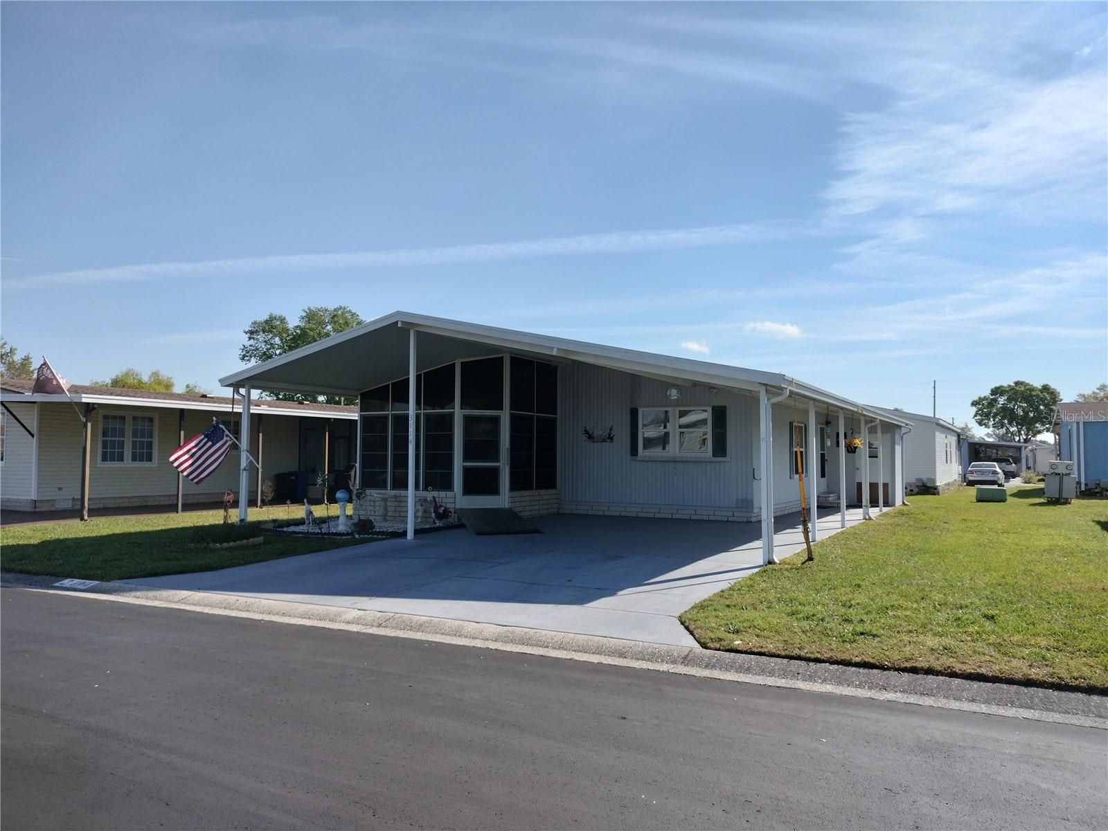 Welcome to Timber Lake Estates, an all aged community! This wonderful 2 bedroom 2 Bath furnished home is waiting for you. This home features double parking and storage shed, a front Florida room with windows and French doors that enter into the large living room. The Master suite with walk-in closet also has French doors that lead into the master bathroom. Walking distance to the clubhouse and pool. NEW A/C in 2024.This home is in a great location with easy access to Wesley Chapel and Zephyrhills. All this and located in a very desirable all aged well kept family oriented community with tons of activities and great amenities some of which include 2 pools, 2 clubhouses, Shuffleboard and Basketball courts, fishing lake with dock and gated security and YOU OWN THE LAND.