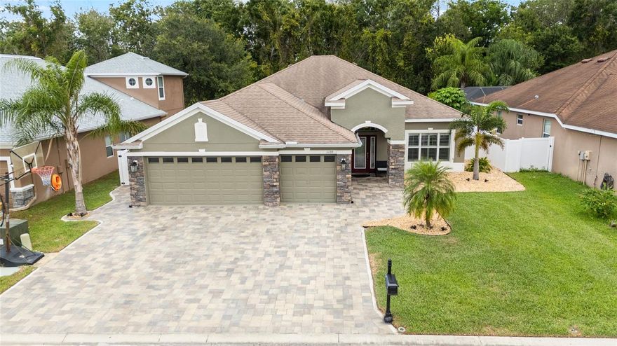 STUNNING HOME WITH STUNNING CURB APPEAL!! This home is a looker and truly looks brand new! Immaculate 4 BEDROOM, 3 bath + OFFICE, 3 car GARAGE home nestled on a gorgeous FENCED CONSERVATION. It is located in a GATED community of Waters Edge. The schools are HIGHLY RATED. Exterior stone has gorgeous accents "country rubble coastal brown" Open floor plan ~ family room, kitchen and breakfast area with views to the screened patio overlooking an enclosed CUSTOM pool with a rock grotto waterfall and hot tub with a serene conservation area. Relax and enjoy the wildlife while grilling in your own cooking area. Kitchen 42" Maple stagger wall cabinets accented with CROWN MOLDING. Counter tops and newer sink with NEW quarts countertops in kitchen and NEW subway tile backsplash. NEWER STAINLESS-STEEL appliances 2024. Refrigerator 2021. Inside laundry with laundry sink and built in cabinets. Master suite features private bathroom, garden tub, walk in shower, deco tile in all bathrooms, CUSTOM BUILT IN'S - walk in closet and newly added closet. DOUBLE PANE windows. PLANTATION SHUTTERS THROUGHOUT. Ready to move in. NEWER INTERIOR AND EXTERIOR PAINT including new glass door and baseboards. NEW SOD in front yard 2025. Approx 2023 NEW A/C. Security System. Newer smart water heater 2023, owned Water Softener. SCREENED PORCH with slide screening and remote-controlled fan/light. Open patio with PAVERS. 3 CAR GARAGE. Preferred flood zone "X". NO FLOOD INSURANCE REQUIRED. Resort style 9,000 sq. ft. clubhouse: fitness center; media, game, & large entertaining room; Grand swimming pool at the base of the Lake. Basketball court. Two fishing piers overlooking exquisite spring-fed lake. Reclaimed water 2 x a week, cable and garbage pick-up included. Security. A must to see!

This owner has made over 150k in recent upgrades: To name a few... New paver driveway, sidewalks, paver stairs and patio, new barn doors for office, new turf play area/dog run, new pool heater, new stone fireplace, new crown molding, new sprinkler system, hot water heater, NEW extended full length of home screened lanai with no seeum screen and 2 doors. NEW pool/ spa with GROTTO waterfall, NEW paved patio, walkway & firepit area, NEW fencing with oversized gate. (completely fenced back yard with 3 gates), NEW pool Lighting, NEW patio lighting (LED pool lights and LED custom cage lights), NEW landscaping. Lots and LOTS of new. Schedule your showing today!!!