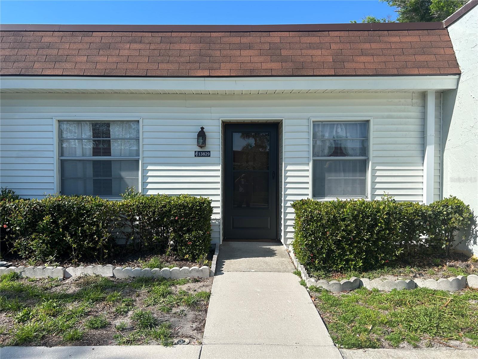 Enjoy easy Florida living in this updated 805 sq. ft. 2-bedroom, 1-bath villa located in the 55+ Mission Oaks community. The home features an open living and dining area with ceiling fans, a fully renovated kitchen and new appliances, and a spacious primary bedroom with walk-in closet. Recent improvements include a new HVAC system (, new roof , fresh interior paint, new flooring, updated lighting, and new front and rear entry doors. The bathroom offers a new vanity, new toilet, and updated plumbing, and the home also includes updated electrical work. Walk across the street to Publix Plaza and Restaurants.
Community amenities include a clubhouse, swimming pool, assigned covered parking, and lighted sidewalks. Conveniently located near shopping, dining, medical facilities, and Gulf beaches. HOA includes cable TV, water, sewer, trash, and exterior maintenance. 55+ community. No pets allowed.