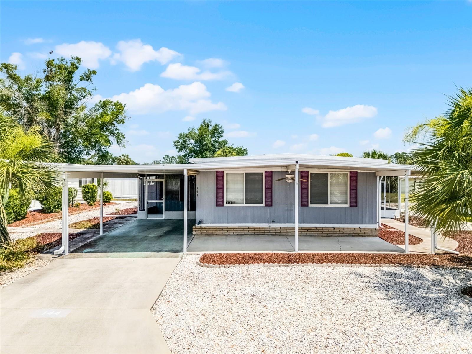Welcome Home to 144 Paradise North in Leesburg, Florida. (No lot rent) If you are looking for Move in Ready then you have found it. Located in the No Pet section of Molokai but if you have a
support animal with papers there are exceptions. The Home was built in 1975 and has 1,117 square feet with 2 Bedrooms and 2 Full bathrooms and 3 Florida Rooms. The Washer and Dryer
are located in the storage shed with an additional Extra Storage Space. The Kitchen has lots of storage with tons of cabinet space and an Island for table dining. You have lots of Living space
with a living room; features very light and bright with natural lighting which leads to Two Florida Rooms! The Primary Bedroom is spacious with an En-Suite Bathroom. The Home Features
Three Florida Rooms. The First Florida Room is Enclosed and right off the Living Room with separate air conditioning system. The Second Florida Room is Located with Slider doors from the
first it is Screened in and overlooks the front of Home. The Third Florida Room is located off the Kitchen and Fully screened looking over the carport. The home is Located in Molokai Co-op, a
highly sought after and affordable 55+ Community in Leesburg, FL. Molokai offers lots of activities, a pool, a recreation center and your monthly fee includes cable, internet, water, trash and
sewer. Not to forget the Location! You are close to Shopping, Restaurants and major highways. Also, you are not far from Downtown Mount Dora, Downtown Tavares and Downtown Leesburg
and all the festivals and events that are offered! If boating and fishing are a favorite, you are only a short distance to a Public Boat Ramp for The Harris Chain of Lakes. Lake County FL offers
something for everyone. Do not miss your chance to call this Home! Need financing? This home can be financed with a local lender, call for all the details and to schedule a Private Showing!