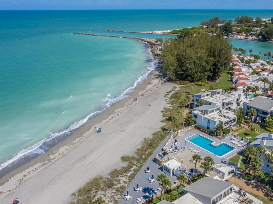 Bahia Vista Gulf, a condo community nicely situated on the Gulf of Mexico on Venice Island. This Amazing 2 BR, 2 BA Turnkey Furnished Condo offers a perfect blend of comfort and coastal living on the Gulf of Mexico. Located on the second floor, the unit features soaring vaulted ceilings that create an open, airy feel complemented by abundant natural light throughout. The comfortable living room opens to the dining room as well as a convenient slider to one of two private balconies. The second balcony offers a breathtaking partial view of the Gulf in turn providing the perfect spot to unwind while enjoying amazing sunsets directly from the master bedroom and is accessed from both the master and guest bedroom. New AC.  Hurricane-rated windows and sliders added in 2018 ensure peace of mind while enhancing this condo's safety and energy efficiency. Also, an inside laundry closet with a new washer and dryer. The bright and well-appointed interior is again fully furnished allowing you to move in and immediately enjoy the beauty and tranquility of Gulf/Beach living at its finest. Whether you're relaxing indoors or outside on the balconies, this condo provides ideal setting to enjoy the sights and sounds of the Gulf coast. Bahia Vista Gulf offers a coming soon renovated private beachfront saltwater heated pool with coming soon renovated sundecks to enjoy socializing and relaxing by the pool. Adding to the desirability for BVG is the fact that there is a minimum 1 month rental and can be rented 12 times a year and it is not a 55+ complex. The condo is only a short walk from your assigned parking spot, guest parking, mailroom, and private storage locker and onsite laundry facility. Offering a great location in a beautiful and friendly community on the beach, close the The Jetty, Crow's Nest, Venice public beach and the Historical Downtown Venice, this is great location, and you won't be disappointed!! Schedule your private showing today and start living your Dream in Paradise!
