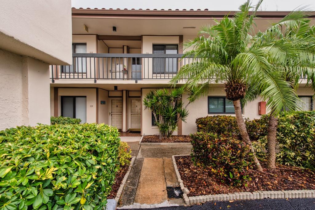 A rare find on Isla del Sol, this beautifully updated first-floor condo blends modern comfort with a true resort-lifestyle setting. The renovated kitchen showcases granite countertops, stainless steel appliances, a breakfast bar, and ample storage. The home flows effortlessly into a spacious open living and dining area that leads to a screened lanai—perfect for enjoying breezy afternoons and quiet mornings. Both bedrooms are generously sized with built-in closets, while the primary suite offers a private ensuite bath with shower and single vanity. A second full bath, a new full-size washer and dryer, brand-new hurricane impact windows, and new flooring add to the home’s appeal. Step outside to world-class amenities: a heated waterfront pool and spa, a fishing pier with postcard-worthy sunrises and sunsets, a clubhouse, and a private lockable storage area in the tower for this unit (approximately 4’ x 4’ x 6’)—ideal for bikes, beach gear, or seasonal items. Optional membership opportunities at Isla del Sol Yacht & Country Club provide access to golf, tennis, and marina facilities. All assessments are paid, and the Milestone Inspection is complete, providing peace of mind for homeowners and investors alike. A premium assigned parking space sits conveniently near the lobby, with ample guest parking available. Plus, its unbeatable location—just 5 minutes to the award-winning sands of St. Pete Beach and Pass-a-Grille, less than 10 minutes to vibrant downtown St. Petersburg, and only 20 minutes to Tampa International Airport. This is more than a home—it’s a lifestyle. Call now and schedule your showing today!