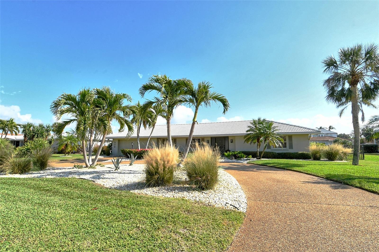 Southern exposure! This remodeled soft contemporary 3-bedroom home embodies refined taste and gracious living, offering a perfect blend of Florida elegance and functionality. The impeccable open design showcases captivating views from nearly every room, complemented by effortless living with travertine flooring and a fabulous entry foyer. The kitchen, a chef's delight, features granite countertops and abundant storage and seamlessly flows into the living and dining areas.
The spacious master bedroom offers serene views and an ensuite bath with a large walk-in closet. Outdoors, the pool, expansive paved lanai, and private dock with boat and kayak lifts surround lush landscaping, creating an oasis of elegant yet relaxed living.
Located in the heart of Longboat Key, this home grants access to sophisticated amenities, including the option of social memberships at the Longboat Key Club, as well as Sarasota’s vibrant cultural scene, featuring art galleries, antique shops, fine dining, and upscale boutiques.
Sarasota, on Florida’s west coast, with its white, sugar-sand beaches, offers an unequaled lifestyle. Enjoy all the amenities of elegant living, plus the social and enriching events that make Sarasota the cultural capital of Florida. Experience the excitement of the Sarasota Opera, the Sarasota Ballet, the West Coast Symphony, the Ringling Museum of Art, and a multitude of independent theater companies. Sarasota bustles with many art galleries and antique shops. From New York bagels to elegant bistros and world-class restaurants, its marinas, and golf courses, Sarasota offers something for everyone.
The property has remained unaffected by the 2024 hurricanes or water intrusion, providing peace of mind in your coastal sanctuary. With an updated, open split floor plan designed for privacy and convenience, this residence is ready for your personal touch. You will love the sunny bike ride or refreshing walk that takes you to the exclusive beach access that leads to the white sand shores of the Gulf of Mexico.
