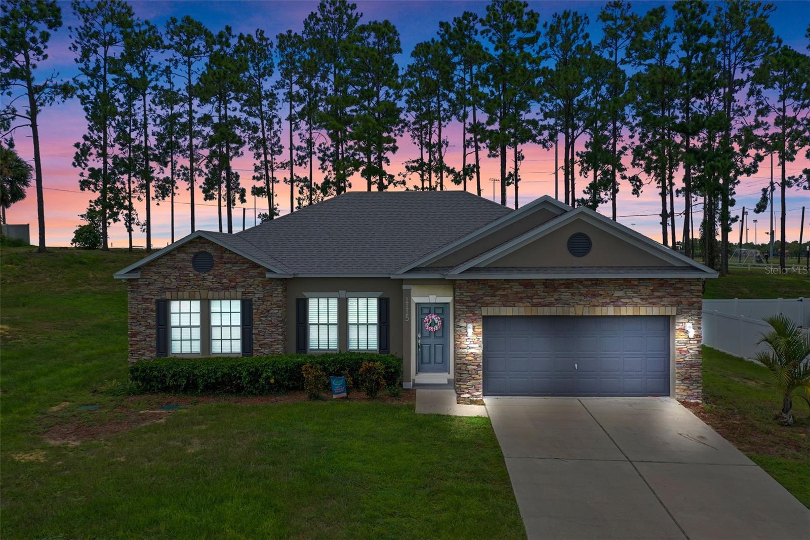 Prime Minneola Location! Welcome to this beautifully updated 4-bedroom, 2-bathroom home situated on nearly half an acre in a quiet cul-de-sac in one of Central Florida's Top Rated School Districts. Freshly painted inside and out, this home features stylish updated flooring and an open-concept kitchen with stainless steel appliances, and plenty of storage—perfect for entertaining or everyday living. Enjoy Florida living year-round with a screened lanai and an extended brick paver patio overlooking your expansive backyard. The roof was replaced in 2023, giving you peace of mind for years to come and saving you money on home insurance. Just a block from Lake Minneola High School and right across the street from the Minneola Athletic Complex. You’ll love the convenience of being less than 2 miles from the Florida Turnpike, the new Publix shopping center, and the soon-to-be-built Crooked Can Brewery. With two separate entrances into the neighborhood, coming and going is a breeze. Don’t miss your chance to own this move-in ready home with space, updates, and an unbeatable location! This area in Minneola is about to BOOM! Get in while you can!