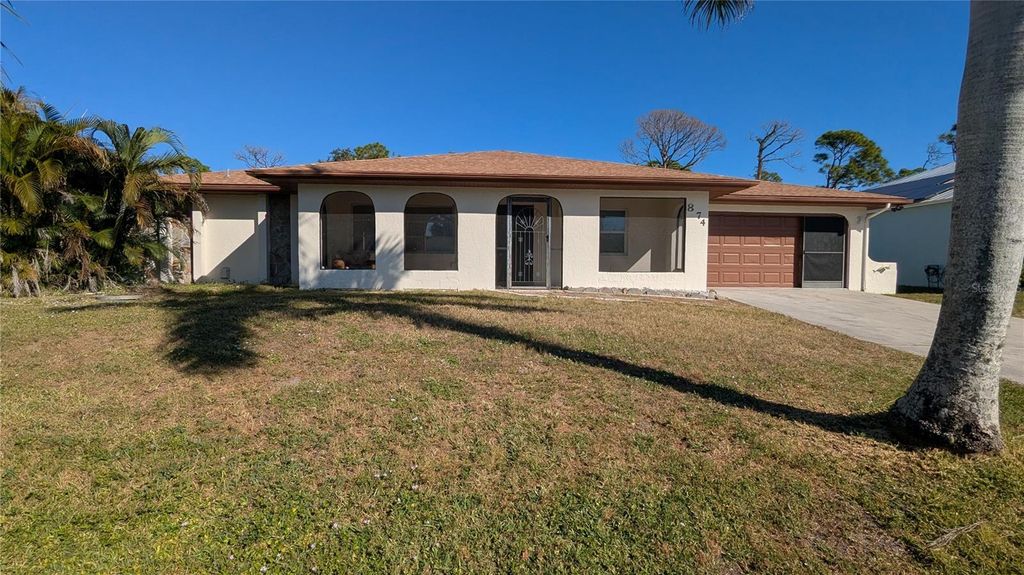 Photo of 874 Dolphin Avenue NW, Port Charlotte, FL 33948 (MLS # C7517354)