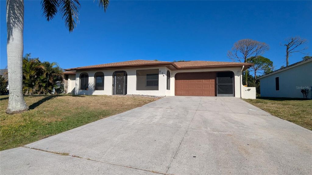 Photo of 874 Dolphin Avenue NW, Port Charlotte, FL 33948 (MLS # C7517354)