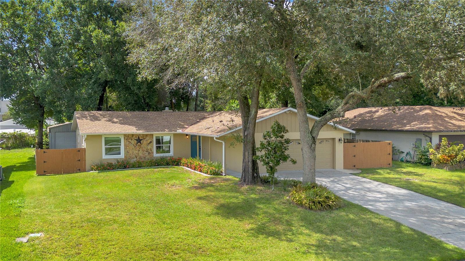 Welcome to a beautifully renovated 3-bedroom, 2-bathroom home nestled in the desirable Wekiva Ridge neighborhood of Apopka, FL. Situated on a spacious quarter-acre fenced lot with no HOA, this move-in ready property offers both privacy and modern comfort. Step inside to find luxury vinyl plank flooring throughout the main living areas, an updated kitchen featuring granite countertops, soft-close shaker cabinets, stainless steel appliances (including a Bosch refrigerator), and a large breakfast bar that opens seamlessly into the living room. A cozy wood-burning stone fireplace anchors the living space, adding warmth and charm. The spacious primary suite boasts a walk-in closet and a private en-suite bathroom with a stand-up shower. Recent upgrades include a new roof (2021) and energy-efficient double-pane windows, offering peace of mind and long-term savings. Enjoy the outdoor living under the covered enclosed patio or the large fenced in back yard, perfect for relaxing, entertaining, or even adding a pool. Conveniently located and within walking distance from the shcools, just .02 away and minutes from Wekiwa Springs State Park, Kelly Park, shopping, restaurants, and major highways including I-4, 429, and Wekiva Parkway. This is a rare opportunity to own a fully updated home in a quiet, established community with no HOA restrictions. Schedule your private showing today!