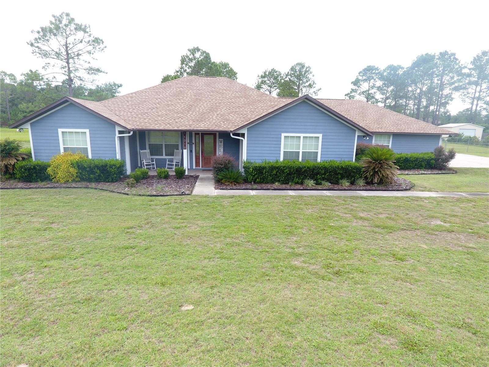 BUCK BAY, Chiefland, FL - Spacious 3BR+sunroom, 2.5 bathrooms exquisite home in Buck Bay Subdivision on a beautifully manicured 1-acre lot. Located in homes only subdivision close to schools, shopping, restaurants, Chiefland Golf Course, Manatee Springs State Park, and public boat ramps on the Suwannee River which lead to the Gulf for great boating and fishing. Deed restricted gorgeous community, homeowner association fee is only $75 per YEAR. Numerous features include chain-link fenced back yard, heated & cooled sunroom/porch which is currently being used as an office and overlooks the large picturesque back yard, oversized walk-in pantry, recessed lighting, water treatment system, irrigation system, updated vinyl plank flooring, granite countertops in kitchen and laundry room, stainless steel appliances in the kitchen even includes a wine refrigerator, new well pump 2019, new roof/tube sky lights in 2024 , two-car garage with access to the attic even has an electric car charger. An expansive concrete driveway with a large apron provides plenty of additional room for parking when you have guests. The apron has a double gate to provide easy access to 20x21 metal shed with roll-up and walk-thru doors for added storage. New technology features are Ring Security and Nest thermostat so you can operate your room temperature to be higher when you are away from home and to be nice and cool before you return. Total living space is 2133 square square feet and 3248 is total area square feet under roof. A lot of bang for the buck - put this one on your MUST SEE list!