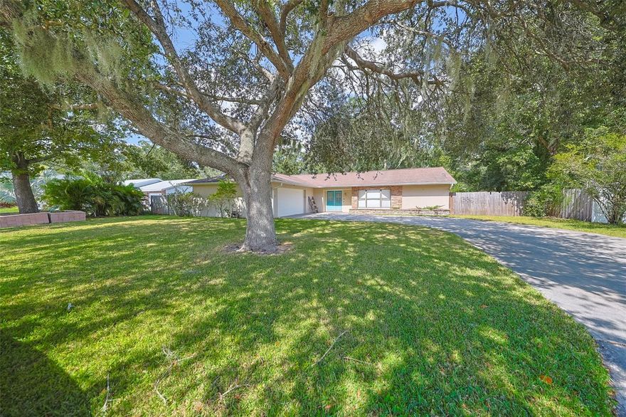 3 Bed | 2 Bath | Oversized 2-Car Garage | Screened Pool | No HOA | No CDD. Bring your boat, RV, trailer, or recreational toys! Situated on a 100x133 oversized lot with a long driveway that accommodates up to 9 vehicles, this move-in-ready pool home offers space, privacy, and comfort with no rear neighbors! The master suite is generously sized, featuring an en suite bathroom and direct access to the screened pool area. Your backyard oasis includes a huge screened lanai, a 30x12 pool with plenty of decking for entertaining, and a fully fenced yard with a single gate that can easily be converted to a double gate, providing access to store your boat or trailer. Inside, the split floor plan features a large living room, separate dining area, and no carpet throughout—ceramic tile in the main areas and wood flooring in all bedrooms. Every room includes ceiling fans for comfort. The bright, spacious kitchen includes solid wood cabinetry with pull-out drawers, decorative lighting above and below the cabinets, and granite countertops. A window above the sink overlooks the beautiful backyard and pool area. Recent updates include a new water heater, bathroom light fixtures, sump pump, and pool pump (all in 2025), plus a new pool motor (2024) and fresh interior paint in the living and dining areas. Located just minutes from dining, shopping, entertainment, schools, parks, gyms, and hospitals, with convenient access to major highways, this home offers an easy commute to MacDill Air Force Base and Tampa International Airport. This home truly has it all—spacious, private, and perfectly maintained—with No HOA or CDD fees holding you back. Schedule your showing today and make this pool home yours!