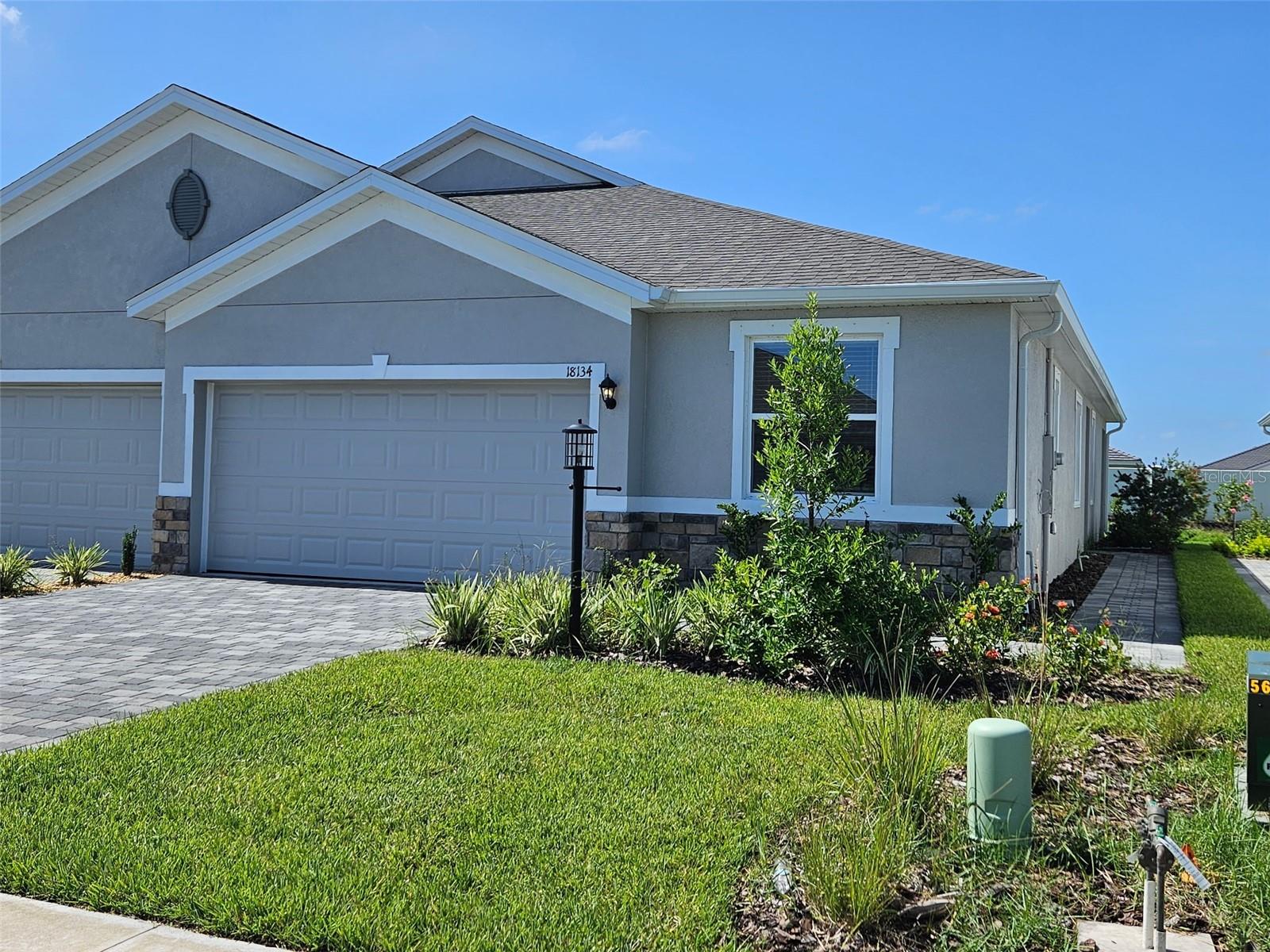 MOVE IN READY! REDTAG SALE: Receive up to $25,000 towards closing costs and special interest rates with the use of our preferred lender Now to July 31st.This one-story, all concrete block constructed home has a truly open concept plan, featuring a spacious kitchen with a large granite kitchen island that overlooks a large dining area, great room, and breakfast nook which flow out onto a covered lanai. The first phase of The Resort Club amenity center is NOW OPEN, including Trade Route Coffee Kitchen, Resort Style Pool, Fitness Center, Athletic Performance Center, and Pet Park. Future phases of The Resort Club will include a poolside bar & grill, outdoor activities area, The Event Center, and The Terrace Chef’s Patio. Future amenity centers, Adventure Retreat & Cabana Corner, will include Pickleball, Tennis & Bocce Courts, Pet Park, Golf Cart Parking, Sunset Terrace, Clubhouse, Resort Pool & Spa, Resistance Pool, Poolside Cabanas & Beach Area, Outdoor Activities Area, Poolside Grilling and more. This home comes with stainless steel dishwasher, range, and microwave. Pictures, photographs, colors, features, and sizes are for illustration purposes only and will vary from the homes as built. Home and community information including pricing, included features, terms, availability and amenities are subject to change and prior sale at any time without notice or obligation.