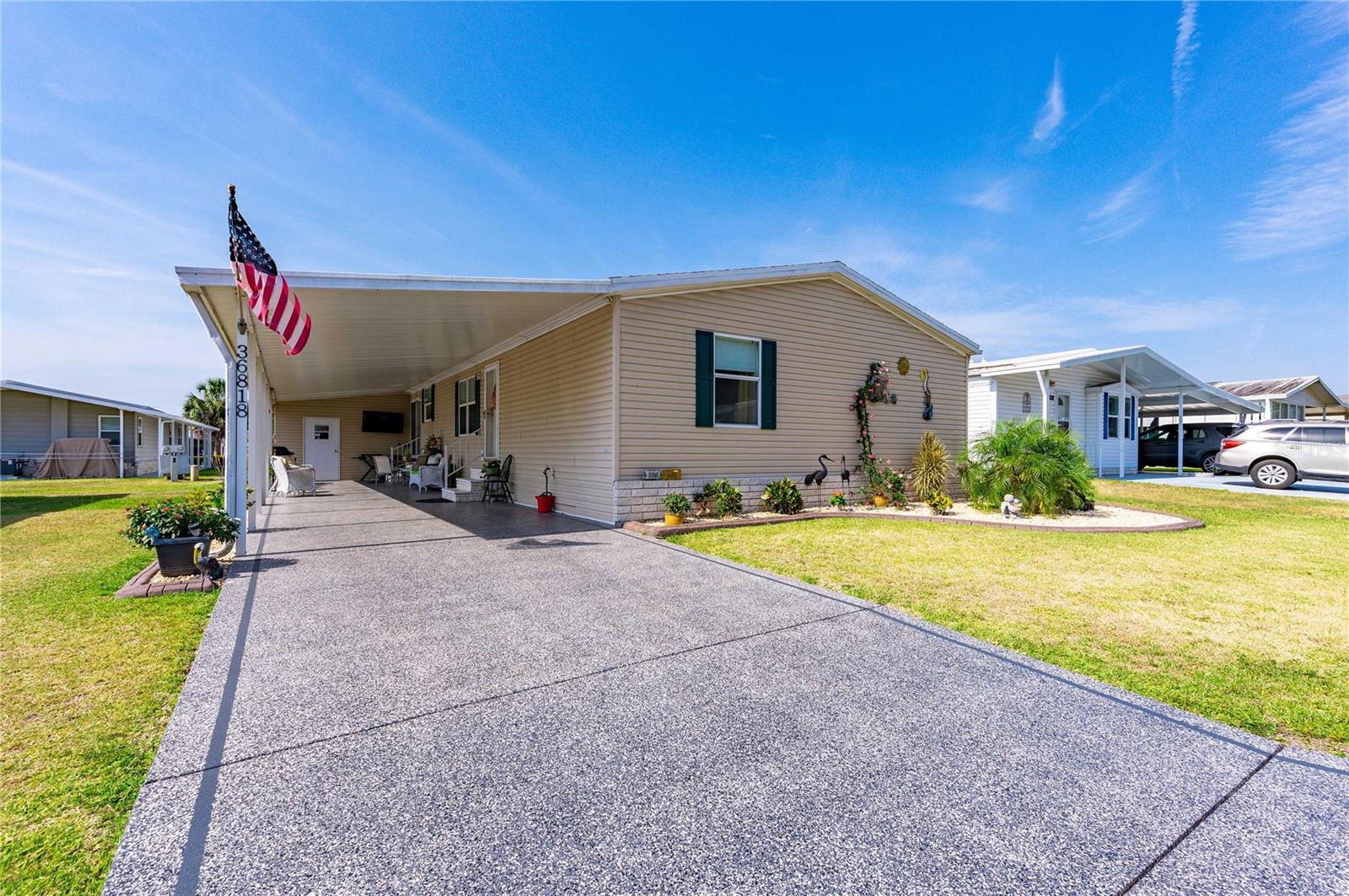 Your Betmar oasis awaits here at 36818 Tara Avenue! This three bedroom, two bath home has been meticulously maintained so if you are looking for move-in ready, this is the place for you!! Inside you will find an oversized galley kitchen with an eat-in area, maple cabinetry, tile floors and a pantry for extra storage. The living and dining areas are combined giving a spacious feel plus it is a wonderful area to entertain. This area also has new wood-look vinyl plank flooring and sheetrock walls. The two guest bedrooms are along the front of the home, are of ample size and have laminate flooring. The primary bedroom accommodates a king-size bed and it too has laminate flooring. The primary bath has dual sinks, walk-in shower, tile flooring and plenty of space for storage. The office is off this primary bedroom suite and easily fits a desk and a couple of chairs for those who may work from home or who want to keep paperwork out of sight. This area could also be used for extra storage or maybe an exercise room. The majority of the windows have been replaced in this home with double-pane, tilt-in windows and all have marble sills. There are cathedral ceilings throughout this home giving it an open, airy feel. This home is also being sold mostly furnished. Outside you will find vinyl siding, an attached golf cart shed, a detached shed, a professionally painted driveway, a lovely front garden and a roof that is only one year old. If all of this isn't enough for you, how about Betmar Acres has three beautiful nine-hole golf courses, two swimming pools with hot tubs, 24 covered shuffleboard courts, 12 pickleball courts and many other park amenities and facilities available to park residents and guests. Now is the time to take your next step to make 36818 Tara Avenue your dream home in sunny Florida!