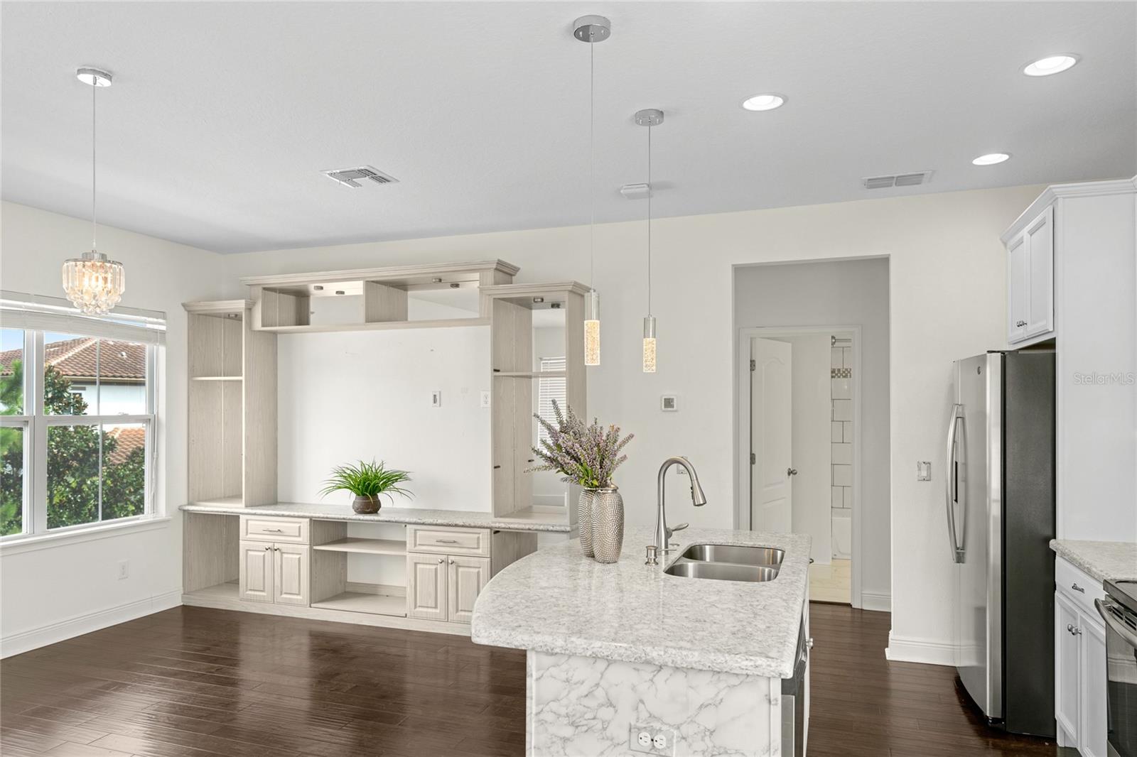 Welcome to this elegant 750 square foot garage apartment located in the heart of Laureate Park. Designed with style and comfort in mind, this residence features a private one-car garage, custom built-ins, and an open layout with no carpet throughout. The kitchen is beautifully appointed with white cabinetry and upgraded light fixtures, creating a bright and modern space. Rent includes all utilities—electricity, water, and internet for a hassle-free living experience. Ideally situated in the desirable Lake Nona area, this apartment offers the perfect blend of sophistication and convenience with easy access to Laureate Park amenities, shopping, dining, and major highways.