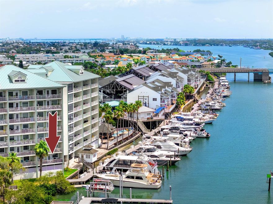 Turnkey 2BR/2BA condo-hotel at Harbourside at Marker 33, just steps to the beach and Splash Harbour Waterpark, the only waterpark on the barrier islands! Located on the Point of the building, this fully furnished 2nd-floor unit offers spectacular, unparalleled direct water views of the Intracoastal from a 23-ft wide balcony, as well as access to a 7th floor rooftop sundeck with stunning sunset views of the Gulf!
Designed for short-term rentals (3-night min, up to 120 days), this property offers excellent income potential and the flexibility for personal use. Split floor plan includes a spacious primary suite with king bed and walk-in shower, and a second suite with two queen beds and a full bath. Open kitchen, dining, and living area with ceramic plank floors, granite counters, shaker cabinets, and in-unit washer/dryer.
Sale includes all furnishings, décor, appliances, linens, dishware, and beach gear—truly move-in or rent-ready. Owners and guests enjoy free daily waterpark passes, rooftop terraces, garage parking, and access to on-site amenities including restaurants, poolside service, adult beverages, and a Tiki Hut. The Waterpark has a lazy river, waterslides, splash pad and pool – something for everyone! Enjoy live music in the evenings, movies and sports projected on a wall of the building, and a Poolside Tiki Bar and gift shop. Harbourside Day Docks are available for our guests traveling by boat. Boat and bicycle rentals are also available nearby. Located near restaurants, shops, and just a short drive to Clearwater Beach, John’s Pass, and two major airports (TPA & PIE).