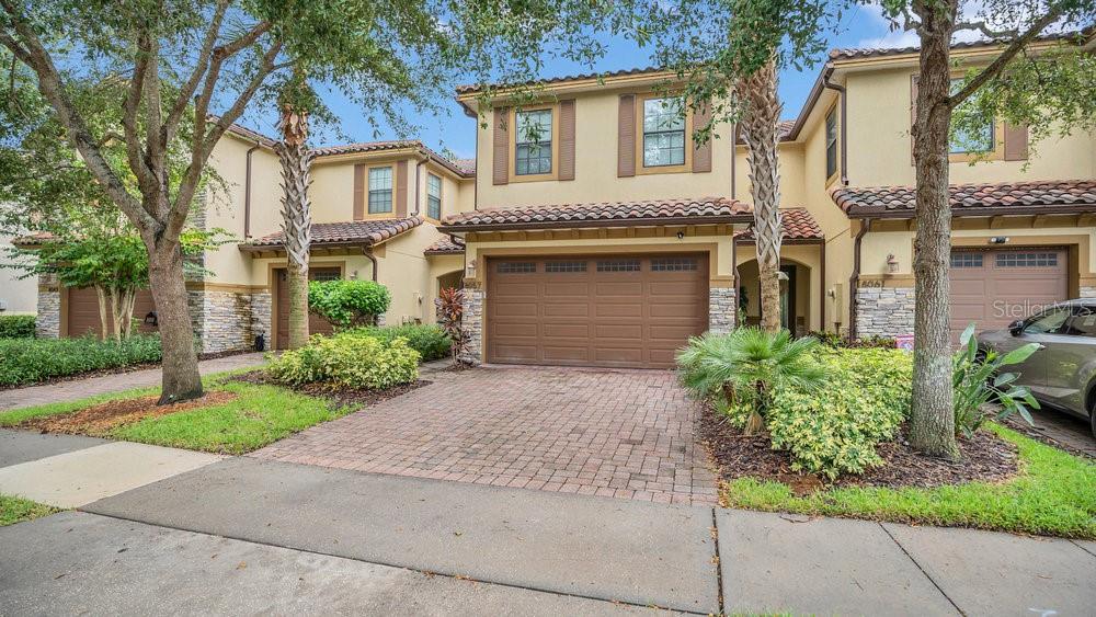 Charming Townhouse in Lake Nona’s Eagle Creek Community Discover the perfect blend of comfort and luxury in this beautifully maintained 3-bedroom, 2-bath townhouse, nestled in the heart of Lake Nona off Narcoossee Road. Enjoy a coveted country club lifestyle with exceptional amenities for the whole family. As you approach the property, you’ll appreciate the mature landscaping, expertly maintained by the HOA, and the convenience of a double car garage with additional driveway space for guests. Inside, the open floor plan invites you into a spacious living area where the well-equipped kitchen, complete with a breakfast bar, overlooks the dining and family room—perfect for entertaining. Step through sliding glass doors onto your screened paver lanai, designed for privacy with vinyl fencing on both sides, creating an ideal spot for relaxation. Upstairs, you'll find the sleeping quarters, which includes a dedicated home office space, ensuring productivity and comfort. The master suite is a tranquil retreat, filled with natural light from multiple windows, plush carpeting, and a ceiling fan for added comfort. The private en-suite features double sinks, a large soaking tub, a step-in shower, and a separate water closet. Two additional spacious bedrooms share another full bath, and a conveniently located laundry closet completes this floor. Eagle Creek offers an abundance of year-round activities, including two resort-style pools with a splash pad, tennis and basketball courts, a public golf course, and a clubhouse with a gym. Enjoy dining at the full-service restaurant and bar, or take a short trip to the Lake Nona Town Center for more dining and shopping options. With Publix Grocery Store and shopping plaza directly across from the community, everything you need is just moments away. Located just two miles south of SR 417, this prime location provides quick access to Orlando International Airport and beyond. Don’t miss your chance to call this stunning townhouse your home—schedule your private viewing today!
