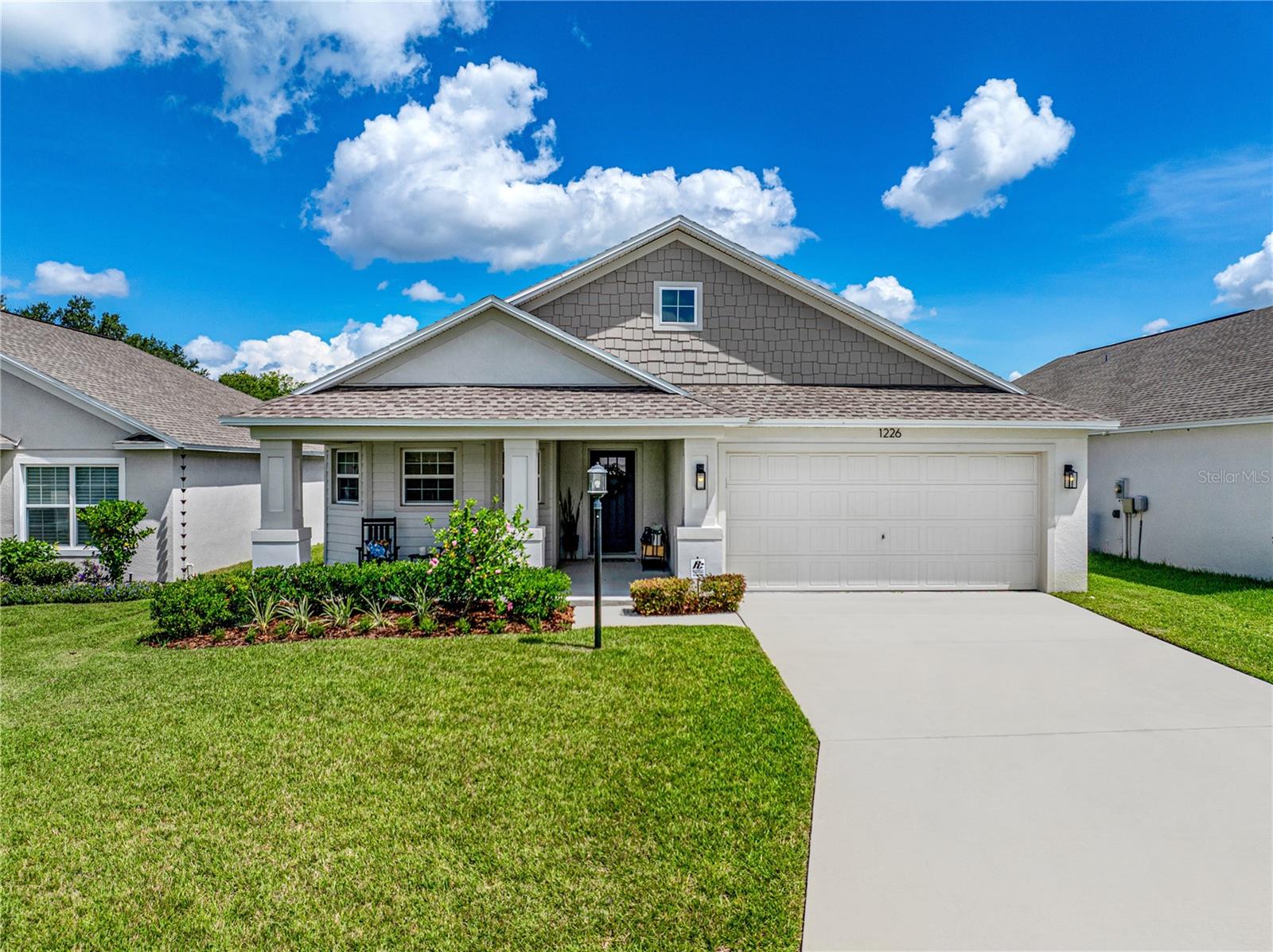 Welcome to Woodland Oaks in South Lakeland, a gated community offering beautiful amenities with low HOA and no CDD! Built in 2024 by Southern Homes, this beautifully maintained 4-bedroom, 2-bath residence is move-in ready and thoughtfully designed with both style and comfort in mind. Step inside to find a welcoming foyer with accent wall details that set the tone for the home. The light and bright kitchen features quartz countertops, tile back splash, stainless appliances, solid wood cabinetry, and a spacious layout that flows seamlessly into the dining area and living room. The living room offers a cozy fireplace and wood accent wall anchors the living space, complemented by luxury LVP flooring throughout. The primary suite offers a private retreat with a en suite bath and a huge walk-in closet, while three additional bedrooms provide flexibility for family, guests, or a home office. An inside laundry room, a large lanai, and a vinyl-fenced backyard make this home as functional as it is beautiful. Woodland Oaks residents enjoy access to a community pool and clubhouse, as well as pickleball courts, basketball courts, a playground, and a dog park. With its prime South Lakeland location, modern upgrades, and unbeatable community amenities, this home is the perfect blend of modern convenience and community living. Call today for your private showing!
