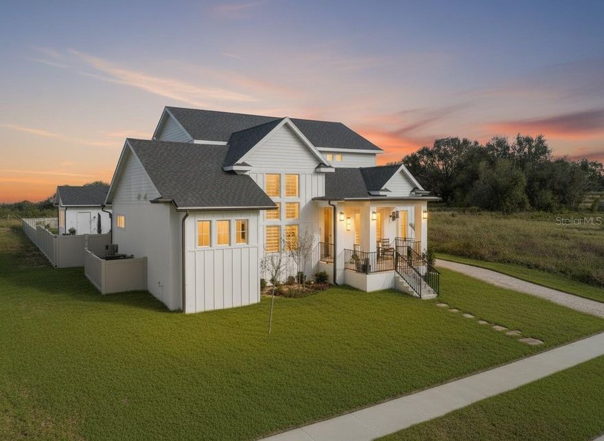 Come see this "Slice of Heaven" near the New Construction hub along N. Hancock Rd. in Minneola! Future easy access to the West Orange Trail! Make this your dream home in the gated Sugarloaf Mountain community of Minneola, perched on a high elevation along the Central Florida Ridge where luxury and craftsmanship come together. 

Built in 2022, this custom Craftsman masterpiece offers over 3,000 square feet of refined living, featuring 3 bedrooms, 3.5 bathrooms, and an impressive 4-car garage—perfect for buyers who demand both elegance and functionality.

From the moment you arrive, the home makes a statement. A lush, landscaped lawn, flagstone walkway, and classic tile rocking-chair front porch lead to a tall custom entry door, setting the tone for the craftsmanship found throughout.

Step inside and prepare to be wowed.

The main living space showcases soaring ceilings, elegant porcelain tile flooring, and a stunning modern floating wood staircase. A dramatic wall of glass floods the home with natural light while framing peaceful views of the private lanai—creating the perfect blend of indoor and outdoor living.

The chef’s kitchen is designed to impress with:
• Premium quartz countertops
• Custom all-wood cabinetry
• Built-in appliances
• Stylish granite sink
• Oversized walk-in pantry with a barn door accent

Just outside, the oversized covered lanai becomes your private resort. Enjoy evenings entertaining with a fully equipped summer kitchen, relax in the 15-jetted high-pressure spa, or gather with friends on the spacious paver patio areas.

The primary suite on the main level is a true retreat featuring:
-Oversized marble floor shower
-Dual vanities
-Private water closet
-Massive 10x12 walk-in closet with custom built-ins and natural light

Also on the main level: a private office, stylish half bath, and upgraded laundry room with sink, quartz counters, and abundant cabinetry.

Upstairs, the custom floating staircase leads to a spacious bonus room, two oversized bedrooms with walk-in closets and en-suite baths, plus an office nook. Every upstairs room enjoys spectacular sunrise views of Lake Apopka on the horizon.

This home also delivers rare high-end construction features, including:
• Dual 20 SEER HVAC systems with HALO air purifiers
• Integrated damper system & linear slot diffusers
• Spray foam insulation in roof, attic, walls, and garage
• Soundproofing for upstairs rooms
• Inspired Shade window coverings

Location is everything—and this one is exceptional. Just minutes from:
• Montverde Academy
• Green Mountain Scenic Overlook
• Lake Minneola High School
• The Clermont Chain of Lakes
• Florida’s Turnpike & Orlando attractions

Homes with this level of design, efficiency, and mountain-ridge elevation views rarely become available.

Luxury. Privacy Craftsmanship.

This is more than a home — it’s a lifestyle.

Schedule your private showing today and make this custom Sugarloaf Mountain masterpiece your NextHome.