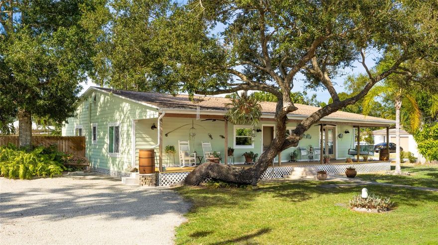 Beautifully maintained and thoughtfully improved, this 1945 Sarasota cottage blends historic character with meaningful modern updates completed over the past 10 years. Recent improvements include the widened crushed shell driveway in 2020, new fencing and gate installations in 2023 and 2025, additional hurricane rated windows installed in 2024 and new fencing around the patio in 2025. These updates enhance privacy, curb appeal, and longevity while preserving the character that makes this property unique. Set on a spacious corner style lot with mature trees, the home welcomes you with a full length front porch that sets a warm and inviting tone. Inside, original hardwood floors, detailed trim, and timeless textures reflect the craftsmanship of its era. The layout includes two true primary bedrooms, each with its own en suite bathroom, providing flexibility for guests, multigenerational living, or separate work spaces. The living room feels bright and comfortable with updated windows throughout. The formal dining room features crown molding, wainscoting, and French doors overlooking the yard. The generous kitchen offers plenty of workspace along with a walk in pantry rarely found in homes of this time period. The fenced backyard is arranged into multiple outdoor living areas including paver walkways, a private side patio, gardening zones, mature landscaping, and rain barrels that stay with the home. Alongside the recent improvements, the seller has completed many additional updates over the past decade that maintain and protect the property’s structure, systems, and original charm. With no HOA, county water and sewer, parking for up to four cars, and a location close to Siesta Key Beach, Downtown Sarasota, shopping, restaurants, and I 75, this home offers the perfect balance of history, character, and practical updates ready for its next chapter. **THIS PROPERTY QUALIFIES FOR A 1% LENDER INCENTIVE IF USING PREFERRED LENDER. INQUIRE FOR MORE DETAILS.**
