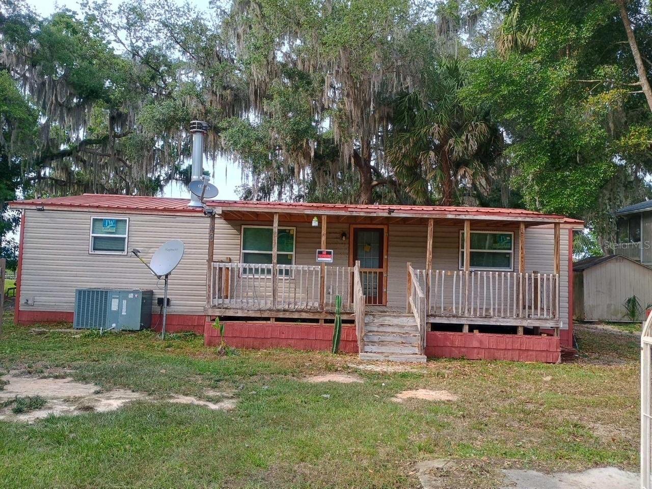 Lowest priced 3/2 on Little Orange Lake by over 200k!! 1.36 acre property on a 600 acre lake. Sold AS-IS. Cash only. All inspections must be done prior to offering. Seller will not remove any personal property. Room measurements are approximate. Please verify if important.