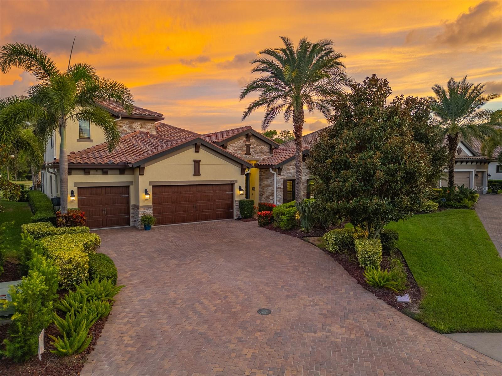 Nestled within the prestigious Promontory neighborhood at Innisbrook, this beautifully appointed 4-bedroom, 3-bath, 3-car garage pool home has been meticulously maintained, and offers over 3,100 sq ft of luxurious golf course living. Extensively upgraded throughout! A custom plunge pool package was added in 2021, featuring a stunning stacked stone waterfall, pavered deck, and more. From the moment you enter, you'll appreciate the architectural sophistication arched entryways, crown molding, coffered ceilings, and designer finishes that elevate every space. The bright, open layout centers around a spacious great room and a formal dining area framed by bold wood beams, ideal for entertaining. Sliding doors open to a covered and screened lanai with an outdoor kitchen and generous lounge space, perfect for enjoying private views of the 11th hole of the Island Course. The outdoor area is truly a private oasis. Back inside, the chef’s kitchen is perfectly designed, with rich espresso cabinetry, granite countertops, an oversized center island with seating and extra storage, pendant lighting, a drawer microwave, newer refrigerator, and premium Thermador appliances including a natural gas cooktop and double ovens. A built-in wine cooler and walk-in pantry complete the space. The downstairs primary suite is a true retreat, with beautiful wood flooring, double tray ceiling, and plantation shutters. French doors lead to a spa-style primary bath featuring dual granite vanities, soaking tub, oversized walk-in rain shower, and a dream custom closet. Also on the main level: a full guest bedroom and bath, plus a versatile den or optional 4th bedroom with barn doors. Upstairs, a spacious 18' x 16' bonus room and third bedroom with full bath provide flexible living space for guests, a media room, or home office. Additional highlights include: Laundry room with built-ins and utility sink, Whole-house water treatment system, Built-in sound and media wiring, Heated plunge pool, Electric blinds, Plantation shutters, Custom closets, Exterior gutters, and a Fully fenced backyard. The three-car garage features upgraded epoxy flooring and ample room for vehicles, storage, or a golf cart. Innisbrook is a resort-style golf and tennis community offering four championship courses—including the world-renowned Copperhead Course, home of the PGA Tour’s Valspar Championship, plus 11+ tennis courts, a fitness center, racquetball, spa, dining, and six heated pools, including the Loch Ness Resort Pool with waterslide. All this just minutes from award-winning beaches, shopping, and dining.