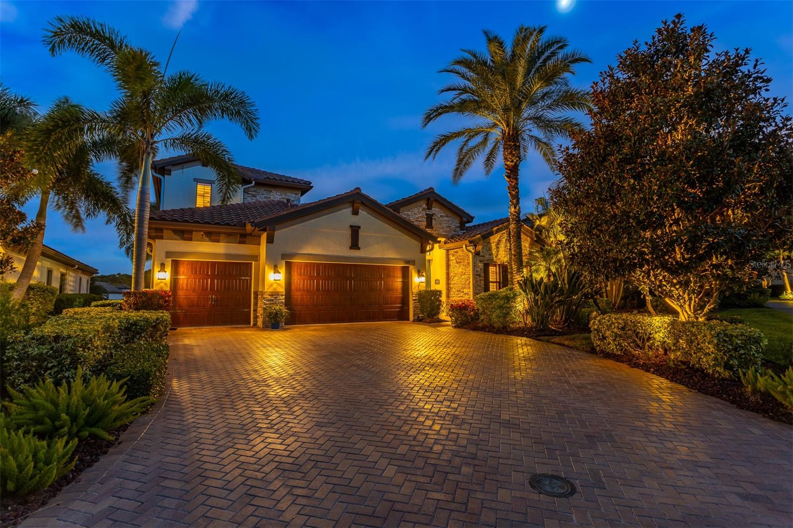 Nestled within the prestigious Promontory neighborhood at Innisbrook, this beautifully appointed 4-bedroom, 3-bath, 3-car garage pool home has been meticulously maintained, and offers over 3,100 sq ft of luxurious golf course living. Extensively upgraded throughout! A custom plunge pool package was added in 2021, featuring a stunning stacked stone waterfall, pavered deck, and more. From the moment you enter, you'll appreciate the architectural sophistication arched entryways, crown molding, coffered ceilings, and designer finishes that elevate every space. The bright, open layout centers around a spacious great room and a formal dining area framed by bold wood beams, ideal for entertaining. Sliding doors open to a covered and screened lanai with an outdoor kitchen and generous lounge space, perfect for enjoying private views of the 11th hole of the Island Course. The outdoor area is truly a private oasis. Back inside, the chef’s kitchen is perfectly designed, with rich espresso cabinetry, granite countertops, an oversized center island with seating and extra storage, pendant lighting, a drawer microwave, newer refrigerator, and premium Thermador appliances including a natural gas cooktop and double ovens. A built-in wine cooler and walk-in pantry complete the space. The downstairs primary suite is a true retreat, with beautiful wood flooring, double tray ceiling, and plantation shutters. French doors lead to a spa-style primary bath featuring dual granite vanities, soaking tub, oversized walk-in rain shower, and a dream custom closet. Also on the main level: a full guest bedroom and bath, plus a versatile den or optional 4th bedroom with barn doors. Upstairs, a spacious 18' x 16' bonus room and third bedroom with full bath provide flexible living space for guests, a media room, or home office. Additional highlights include: Laundry room with built-ins and utility sink, Whole-house water treatment system, Built-in sound and media wiring, Heated plunge pool, Electric blinds, Plantation shutters, Custom closets, Exterior gutters, and a Fully fenced backyard. The three-car garage features upgraded epoxy flooring and ample room for vehicles, storage, or a golf cart. Innisbrook is a resort-style golf and tennis community offering four championship courses—including the world-renowned Copperhead Course, home of the PGA Tour’s Valspar Championship, plus 11+ tennis courts, a fitness center, racquetball, spa, dining, and six heated pools, including the Loch Ness Resort Pool with waterslide. All this just minutes from award-winning beaches, shopping, and dining.