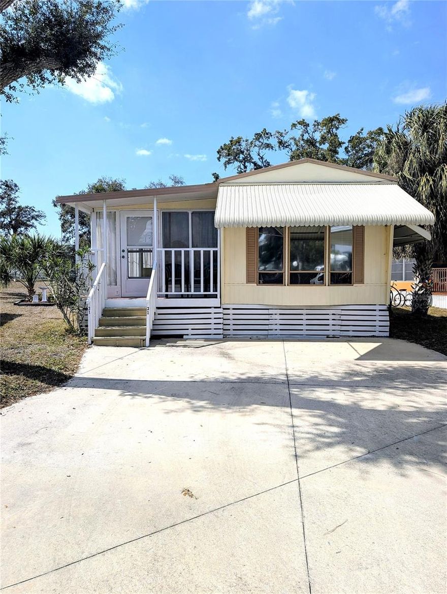 This adorable mobile home is ready for its next owner! The home features one bedroom and one bath, but could easily be converted to a two bedroom home. There are no back neighbors, just community grass and trees. This community prides itself on all of the green space for the owner's enjoyment. This 55+ community features pcikleball, large heated pool, shuffleboard, miniature golf, a billiard's room, tennis and a clubhouse for additional activities. Don't miss this opportunity to live in this beautiful park!