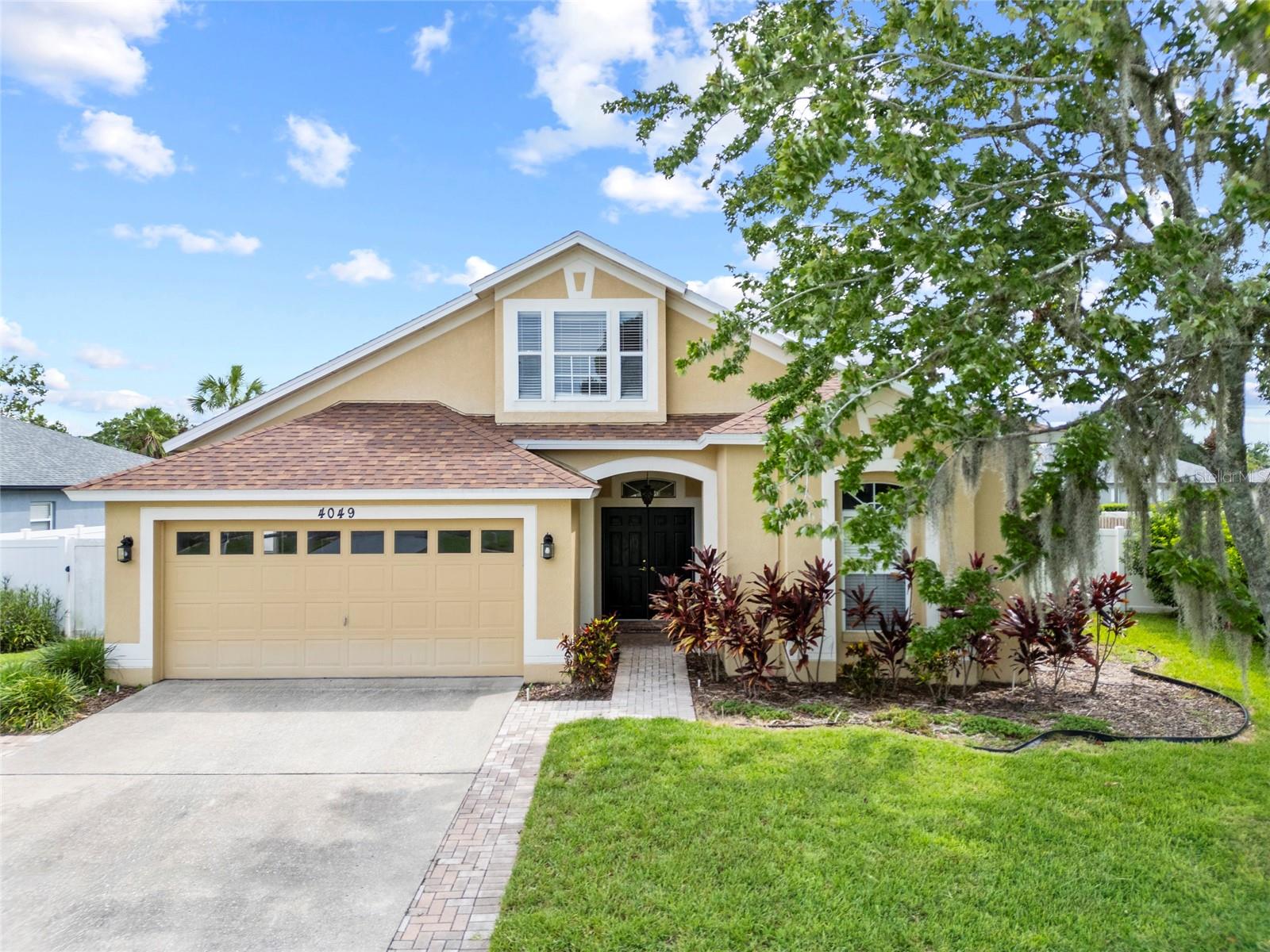 Welcome to this charming home located in the heart of Land O Lakes. This spacious property features 4 bedrooms, 2 bathrooms, and a convenient 2-car garage. Enjoy Florida living with a refreshing inground pool, perfect for relaxation and entertaining. The home also boasts a large bonus room upstairs or a possible 5th bedroom, offering versatile space for your needs. Spacious primary bathroom with dual vanities, tile floors, and a beautiful walk-in shower. This home also features Oak wood cabinets, granite countertops, 2018 A/C system, new hot water heater, 2024 roof, a large fenced in yard. Located near local recreation park that has baseball fields, soccer fields, basketball courts, tennis courts and a community building. Minutes from the Library, shopping, restaurants, outlet malls, and I-75. Put this home on your list, it's a hidden GEM!!