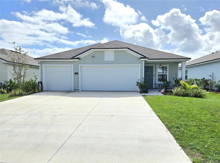 Incredible value ($8k Seller Credit to Buyer) in this new community w/ this 2024 residence, showcasing modern curb appeal and meticulously designed for low-maintenance living. The stunning open-concept interior features significant upgrades. The breathtaking Level 3 Luxury Granite Infinite Waterfall Kitchen Island, featuring Fantasy Brown Color, is truly the heart of this fantastic kitchen, complemented by a chic new backsplash. For year-round comfort, the living room and master suite now boast upgraded, modern ceiling fans. This home is built for savings, including a spacious garage and smart, energy-efficient features promising long-term value. Enjoy the resort-style amenities (clubhouse, pool, gym, dog park, splash, playground & biking tr). Located in a prime spot zoned for fantastic shopping, dining, and excellent schools (Belle Terre, Indian Trails, Matanzas), the location offers incredible lifestyle convenience: just 12 mi to the Beach, 8 mi to European Village shop & dining.