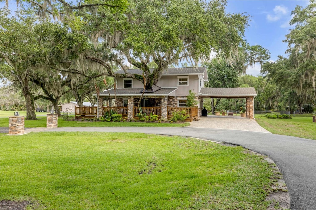 Photo of 800 Hidden Oaks Lane, Oak Hill, FL 32759 (MLS # NS1088593)