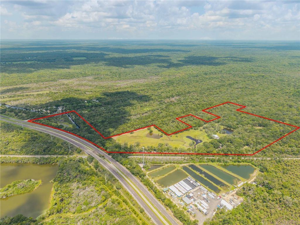 Photo of 800 Hidden Oaks Lane, Oak Hill, FL 32759 (MLS # NS1088593)