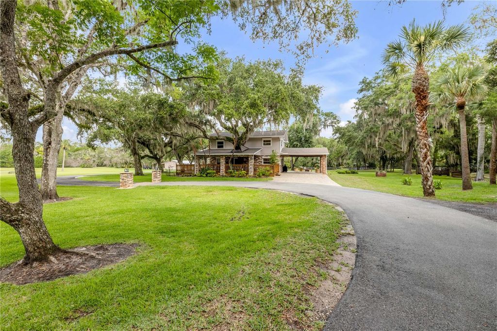 Photo of 800 Hidden Oaks Lane, Oak Hill, FL 32759 (MLS # NS1088593)