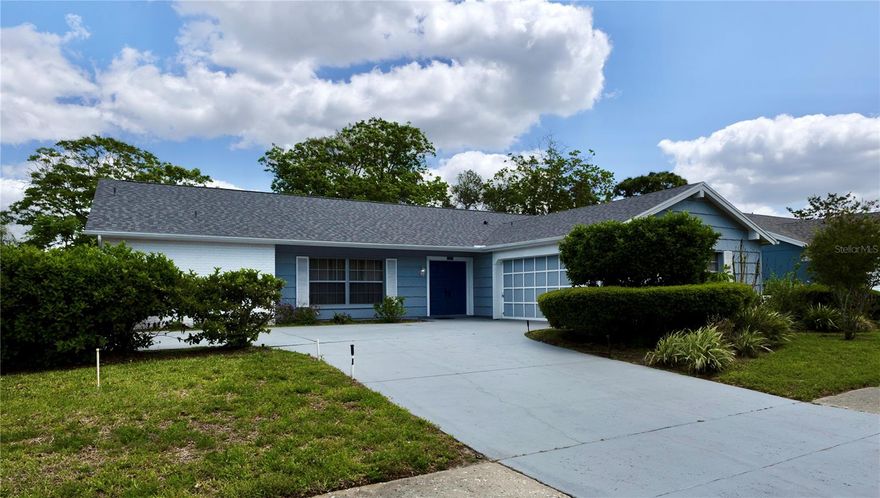 Welcome to this well-maintained 3-bedroom, 2-bath home offering a functional layout and a unique side-entry garage design that enhances both curb appeal and interior flow.

Recent updates include an architectural shingle roof installed in 2025, a 3.5-ton Goodman A/C system installed on April 21, 2022, and GE kitchen appliances (refrigerator, range, and microwave) installed in 2025. The property also features a sprinkler system supplied by a well for lawn irrigation.

The kitchen features solid wood cabinetry and granite countertops, while the interior offers clean, well-kept living spaces and a comfortable layout. A dedicated laundry room includes built-in cabinetry and a folding/work counter. Washer and dryer are included.

Enjoy a spacious screened lanai, ideal for relaxing or entertaining, complete with a convenient kitchen pass-through window for easy indoor-outdoor serving. The generously sized backyard features mature landscaping, offering privacy and plenty of space for outdoor enjoyment.

Located in Ravenswood Village with access to Beacon Woods East community amenities, residents enjoy a clubhouse featuring a pool, tennis and basketball courts, shuffleboard, playground, and an activity center for social events and gatherings, all with a low HOA and no CDD fees.

Conveniently situated near shopping, dining, parks, hospitals, and medical facilities, with easy access to major roadways. The property is also within a short drive to the Gulf Coast, offering access to nearby waterfront parks and beaches.