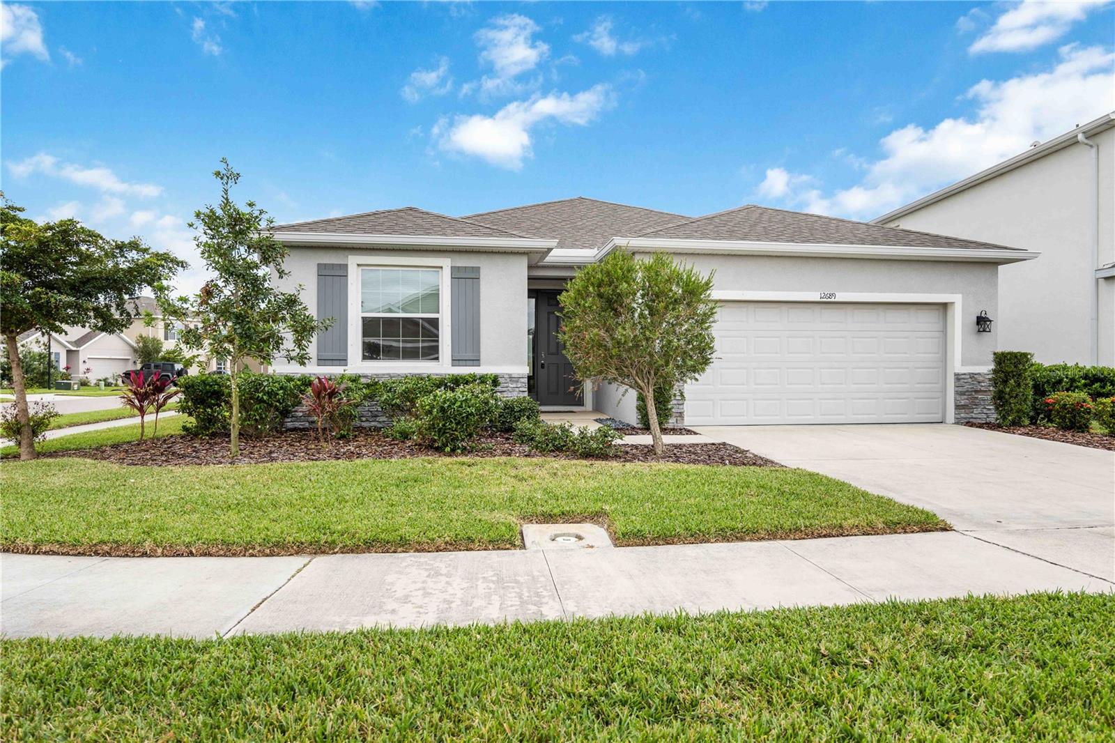Stunning Newer Home in Promenade Estates, Palmer Ranch. Welcome to this immaculate 4-bedroom, 2.5-bathroom single-family home situated on a prime corner lot in the sought-after Promenade Estates community, located in the heart of Palmer Ranch, Sarasota. Built in 2021, this property offers contemporary design, thoughtful upgrades, and the perfect blend of comfort and style. This bright and spacious home features an open floor plan with abundant natural light and high ceilings. The gourmet kitchen is equipped with stainless steel appliances, granite countertops, a large island, and ample cabinetry, making it a dream for any chef. The elegant owner’s suite boasts a walk-in closet and a spa-like ensuite bathroom with dual vanities and a walk-in shower. Three additional bedrooms provide ample space for family, guests, or a home office, while the laundry room adds convenience with extra storage space. The home also includes an attached two-car garage. Outdoor living is a breeze with a covered lanai overlooking the lush landscaping. The spacious corner lot offers extra privacy and plenty of room for future enhancements. Promenade Estates is a gated community that provides residents with resort-style amenities, including a pool, clubhouse, fitness center, and playground. The neighborhood offers easy access to top-rated schools, Siesta Key beaches, shopping, dining, and the Legacy Trail, a favorite for biking and walking enthusiasts. This move-in-ready home combines the best of Sarasota living with modern conveniences and a prime location. Schedule your private showing today!
