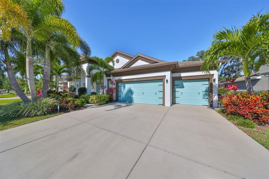 Welcome to a residence that redefines the art of Florida living, where architectural sophistication meets the serene beauty of waterfront conservation views that stretch endlessly beyond your private sanctuary. This stunning four-bedroom, three-bathroom home, encompassing nearly twenty-eight hundred square feet of meticulously designed living space, stands as a testament to what happens when thoughtful craftsmanship converges with an unparalleled natural setting. Gleaming wood floors flow throughout the home with an elegance that whispers luxury beneath every footstep. Crown molding traces the ceilings with refined precision, framing each room like a gallery-worthy composition. The open-concept layout was built for entertainment, and we mean the kind of entertaining that makes your guests conveniently forget they have their own homes to return to. The designer kitchen is nothing short of a culinary masterpiece. Stunning waterfall countertops cascade with contemporary flair, while newer appliances stand ready to accommodate everything from a casual weeknight dinner to an ambitious seven-course affair. This is a chef's dream realized in granite, steel, and impeccable taste - a space where cooking becomes less of a chore and more of a celebration. The private owner's suite is a world unto itself, thoughtfully separated from the remaining bedrooms in a split floor plan that ensures absolute tranquility. This is your personal retreat, a haven designed to cocoon you in comfort after long days spent conquering the world - or at least navigating Florida traffic. The additional bedrooms are generously proportioned, each offering ample space for family, guests, or that home office you have been promising yourself for years. Now, let us talk about that view. The breathtaking water and conservation panorama visible from the home is the kind of backdrop that makes you pause mid-conversation, coffee cup suspended in air, simply to appreciate the magnificence of nature unfolding before you. With no backyard neighbor to interrupt the vista, your privacy is as expansive as the scenery itself. The paver patio extending from the lanai invites you outdoors to soak it all in, while the fully fenced yard provides both security and seclusion in equal measure. This home has been fortified with newer impact glass windows, offering peace of mind when Florida's temperamental skies decide to flex their muscles. A newer roof crowns the structure with dependable protection, and a built-in central vacuum system adds that quietly brilliant convenience that separates thoughtful homes from ordinary ones. Beyond these walls, the surrounding community delivers an extraordinary lifestyle enriched with premium amenities. Scenic walking trails wind through the neighborhood, a state-of-the-art fitness center keeps wellness goals within reach, and a dedicated dog park ensures your four-legged family members enjoy the good life too. A charming neighborhood park sits just moments from your front door, perfect for morning strolls or evening unwinding. Daily conveniences abound with a premier grocery market minutes away, while reputable schools, shopping destinations, medical facilities, and major interstate access ensure that everything you need remains effortlessly close. This is more than a home - it is a lifestyle elevated, a sanctuary perfected, and an opportunity that rarely presents itself with such compelling grace.