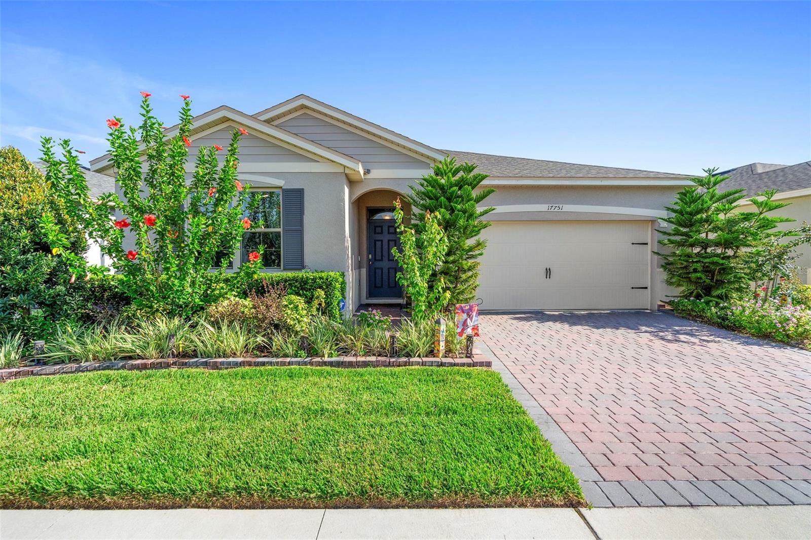 One or more photo(s) has been virtually staged. Welcome to 17751 Blazingstar Avenue—a stunning, like-new home built in 2023, located in the highly desirable 55+ gated community of Palms at Serenoa, just minutes from Walt Disney World. This beautifully appointed 2-BEDROOM residence includes a versatile OFFICE OR ENTERTAINMENT ROOM and offers approximately 1,822 SQ FT of thoughtfully designed living space. Whether you’re searching for a full-time residence or the perfect snowbird retreat, this home checks every box for comfort, quality, and convenience.
Enjoy nightly FIREWORKS VIEWS from your own backyard and take advantage of the home’s prime location near major highways, including I-4, providing easy access to Central Florida’s top attractions, dining, and shopping.
Inside, you’ll find elegant CROWN MOLDING, UPGRADED INTERIOR PAINT, and custom DRAPES that elevate the home’s warm, modern design. The kitchen boasts QUARTZ COUNTERTOPS, an UPGRADED PANTRY with PULLOUT SHELVING and POT RACK, and abundant storage. The laundry room adds functionality with UPGRADED CABINETRY and a PLUMBED SINK.
The PRIMARY SUITE features TWO CLOSETS—including one with CUSTOM BUILT-IN CABINETS—and an en suite bathroom equipped with a BIDET. The SECONDARY BATH offers a WALK-IN BATHTUB for accessibility and comfort.
The OFFICE is finished with CUSTOM FRENCH DOORS, BUILT-IN CABINETRY, and DECORATIVE CEILING BEAMS—perfect for remote work or media enjoyment. A BUILT-IN DUAL-ZONE WINE & BEVERAGE COOLER enhances the space for entertaining.
Outdoors, unwind on your SCREENED-IN PATIO with TRAVERTINE TILE flooring, a 14’ x 14’ HEATED POOL AND SPA featuring 15 MASSAGE JETS, including 3 HOT WATER JETS for therapeutic relaxation. The patio is also equipped with a PLUMBED OUTDOOR SINK, making outdoor cooking and cleanup easy and convenient. The backyard is surrounded by LAVISHLY UPGRADED LANDSCAPING, providing privacy and lush scenery. Most OUTDOOR FURNITURE CONVEYS, including an ELECTRIC SMOKER, GRILL, and PIZZA OVEN—ready for your next outdoor gathering.
Additional upgrades include a WHOLE HOUSE FAN, perfect for drawing in fresh air through open windows, CEILING FANS IN ALL BEDROOMS, a NEW 50-YEAR ROOF (2023), and a FINISHED 2-CAR GARAGE featuring an EPOXY FLOOR, BUILT-IN SHELVING, ON-DEMAND HOT WATER, and an EV PLUG.
Palms at Serenoa offers more than just a home—it provides a lifestyle. Enjoy access to a private CLUBHOUSE with fitness and yoga studios, a zero-entry RESORT-STYLE POOL, PICKLEBALL and BOCCE BALL courts, DOG PARKS, and scenic WALKING TRAILS. The HOA includes lawn care and landscaping for a truly low-maintenance experience. Floor plan available buyer should verify room size and review HOA docs.